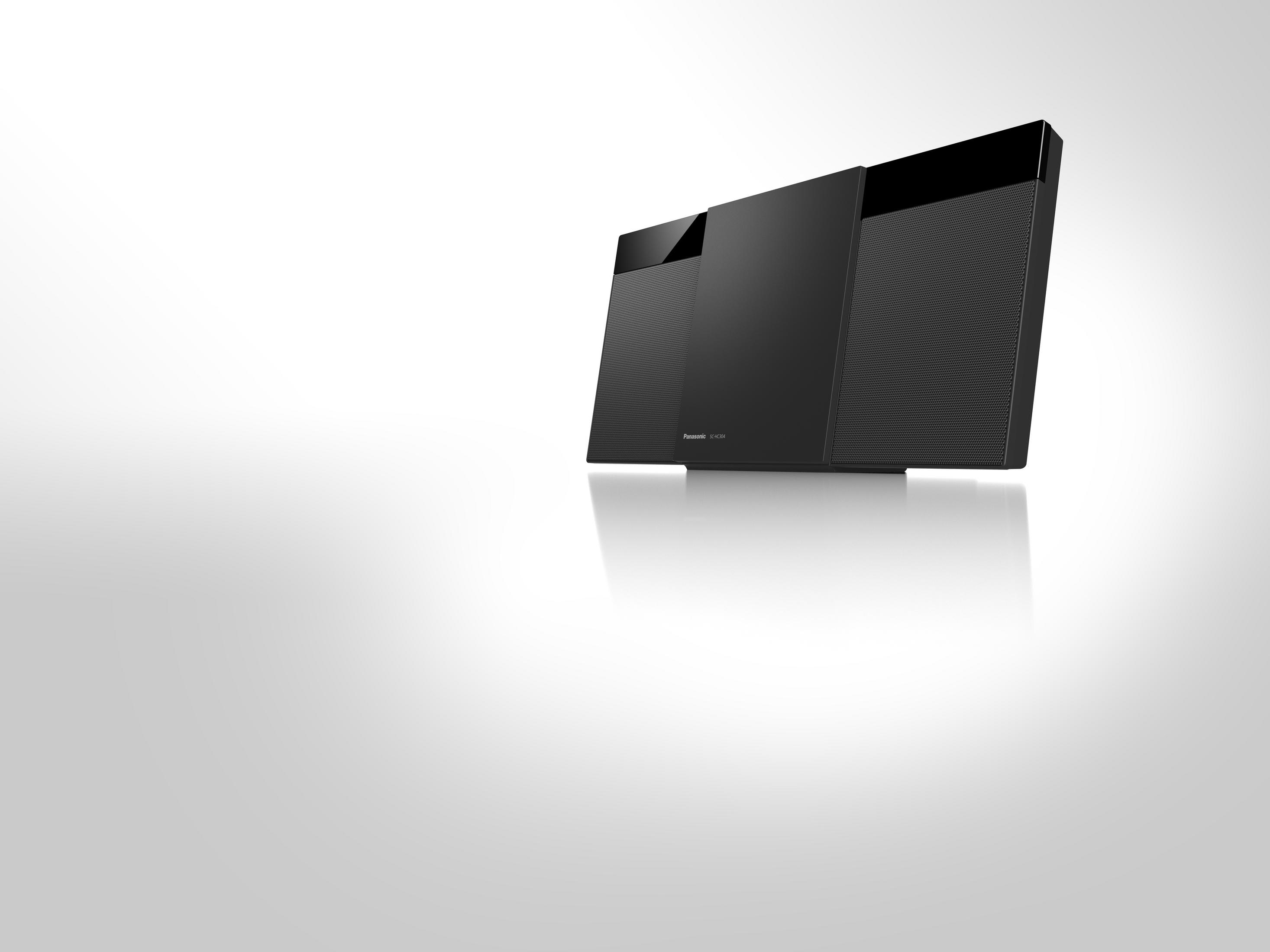 Ein schwarzes Panasonic Audiosystem mit schlankem Design, vor einem Hintergrund mit Farbverlauf.