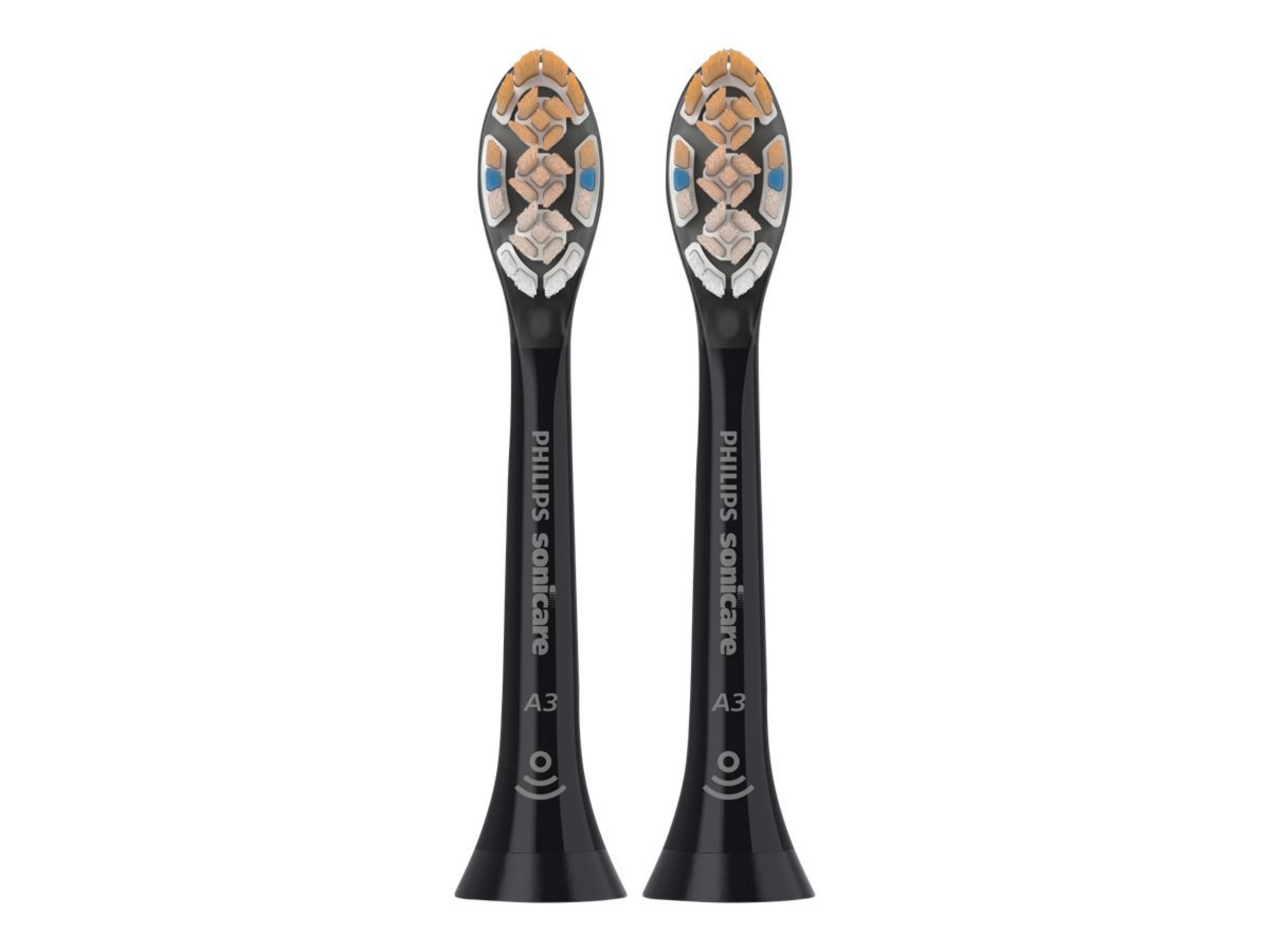 Dwie czarne głowice szczoteczki do zębów Philips Sonicare z białym, pomarańczowym i niebieskim włosiem. Białe tło.