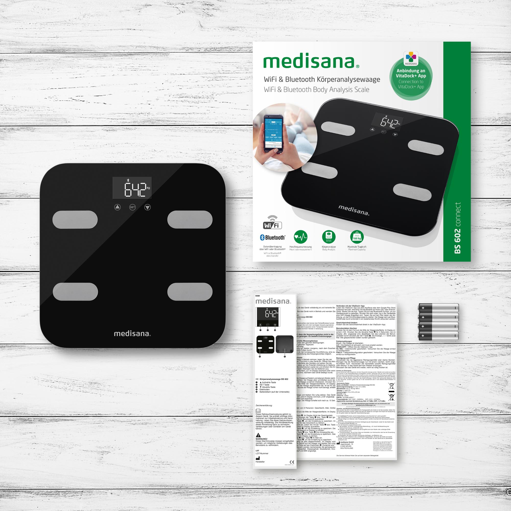 Bilancia digitale nera, scatola con immagine bilancia e foglio istruzioni con batterie.
