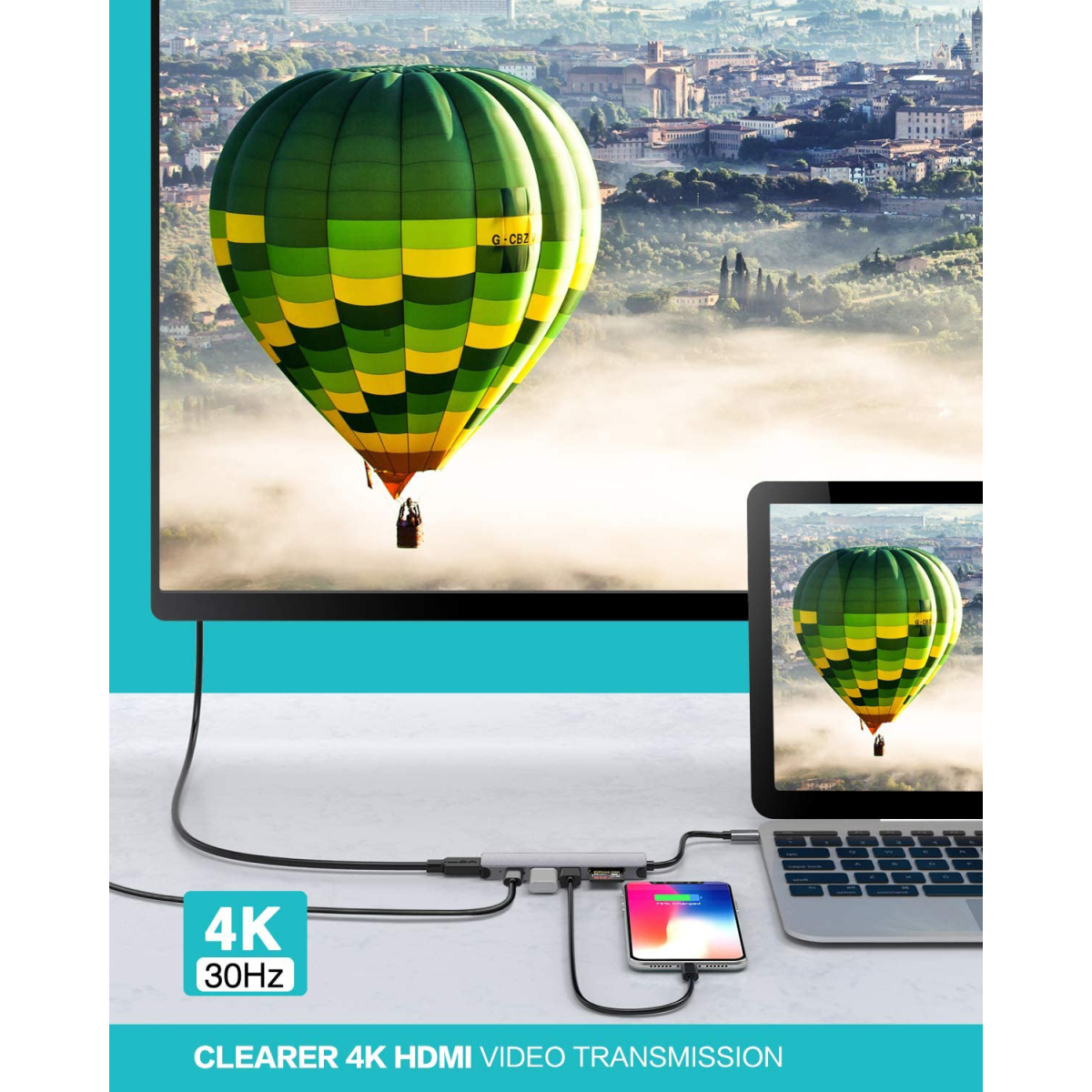 Ein Monitor zeigt einen Heißluftballon über einer Landschaft. Laptop und Hub sind angeschlossen. Text: Clearer 4K HDMI.