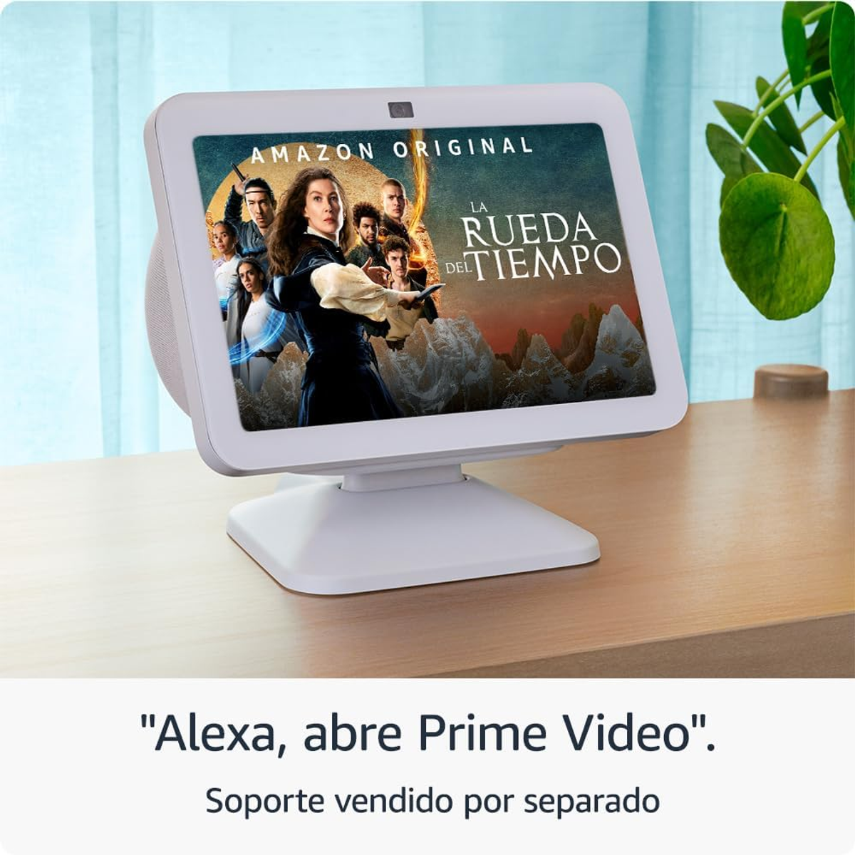 Amazon Echo Show wyświetla promocję programu. Roślina po prawej. Tekst mówi: 'Alexa, otwórz Prime Video'.