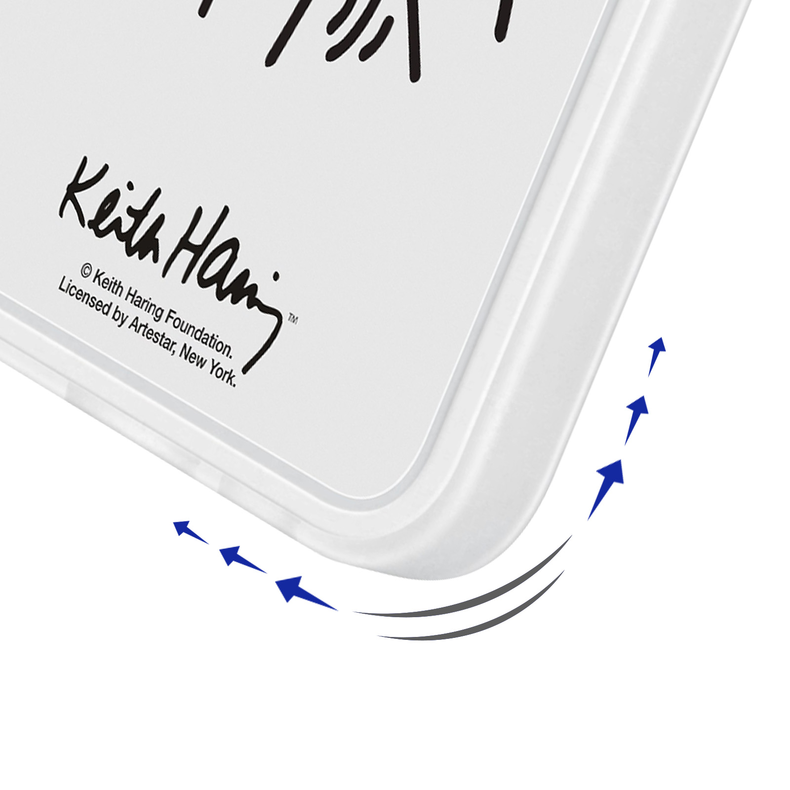 Weiße Tablettenecke mit Keith Haring Unterschrift und Pfeilen.