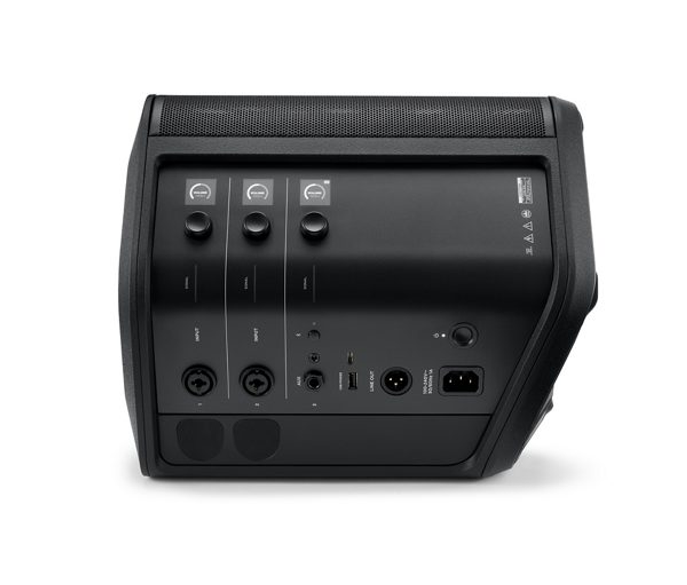 Parte trasera de un altavoz negro con entradas y controles. Está sobre una superficie blanca.