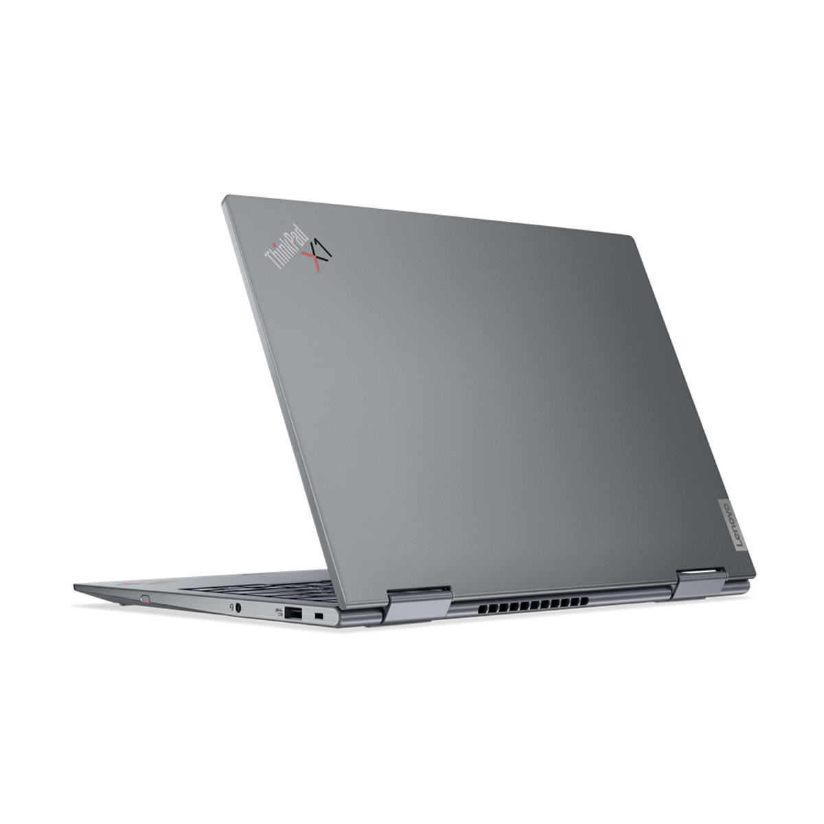 Ein dunkelgrauer Laptop in einer Dreiviertelansicht. Der Deckel ist geöffnet und zeigt die Oberseite der Tastatur.