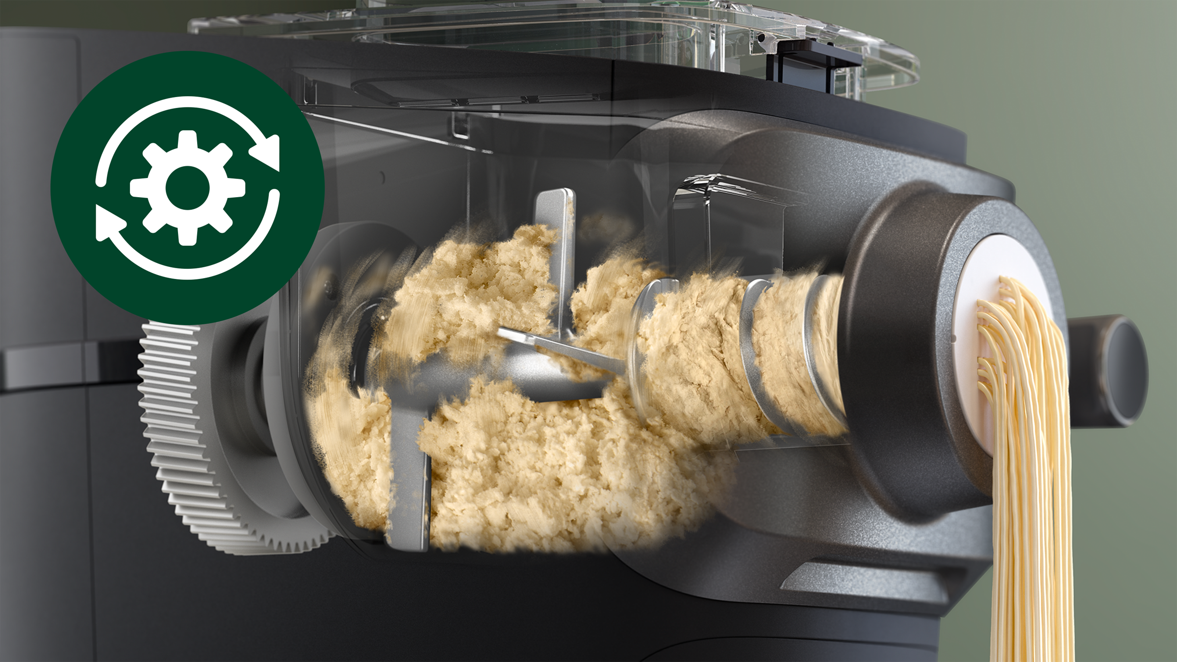 Maszyna do makaronu w akcji, pokazująca mieszanie i wytłaczanie makaronu.