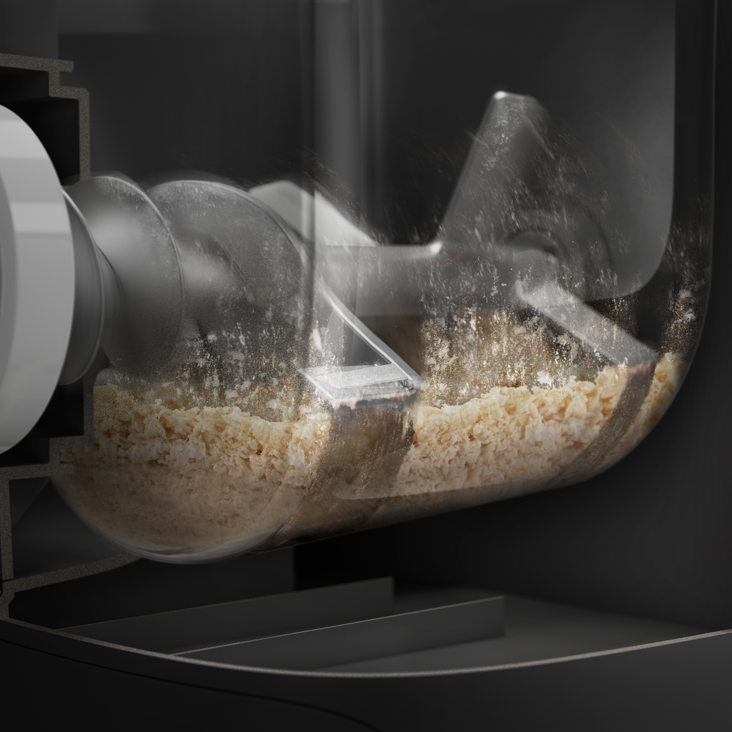 Zbliżenie maszyny mieszającej składniki, z przezroczystym bokiem.