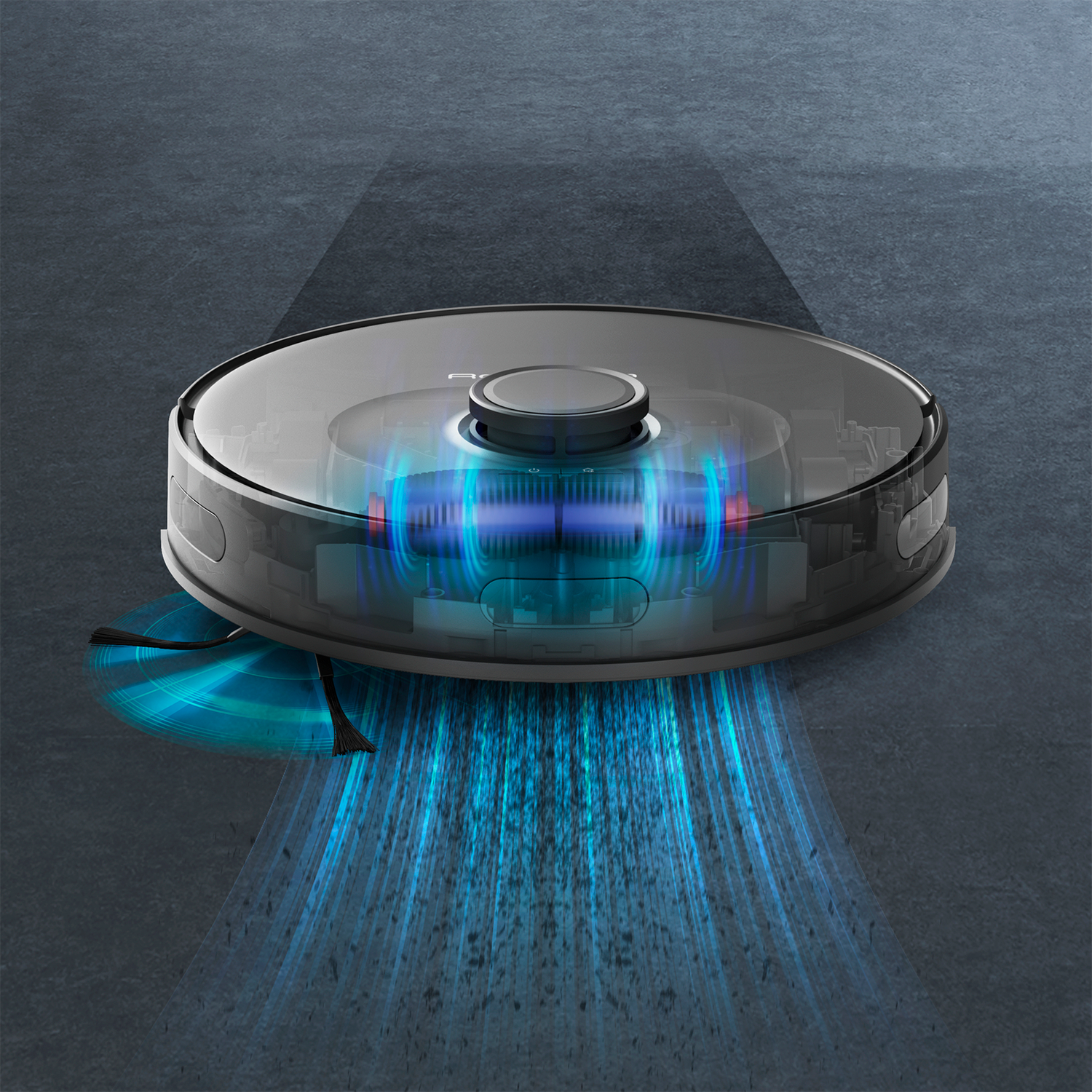 Robot aspirador sobre una superficie gris. Muestra luz azul y los componentes internos.