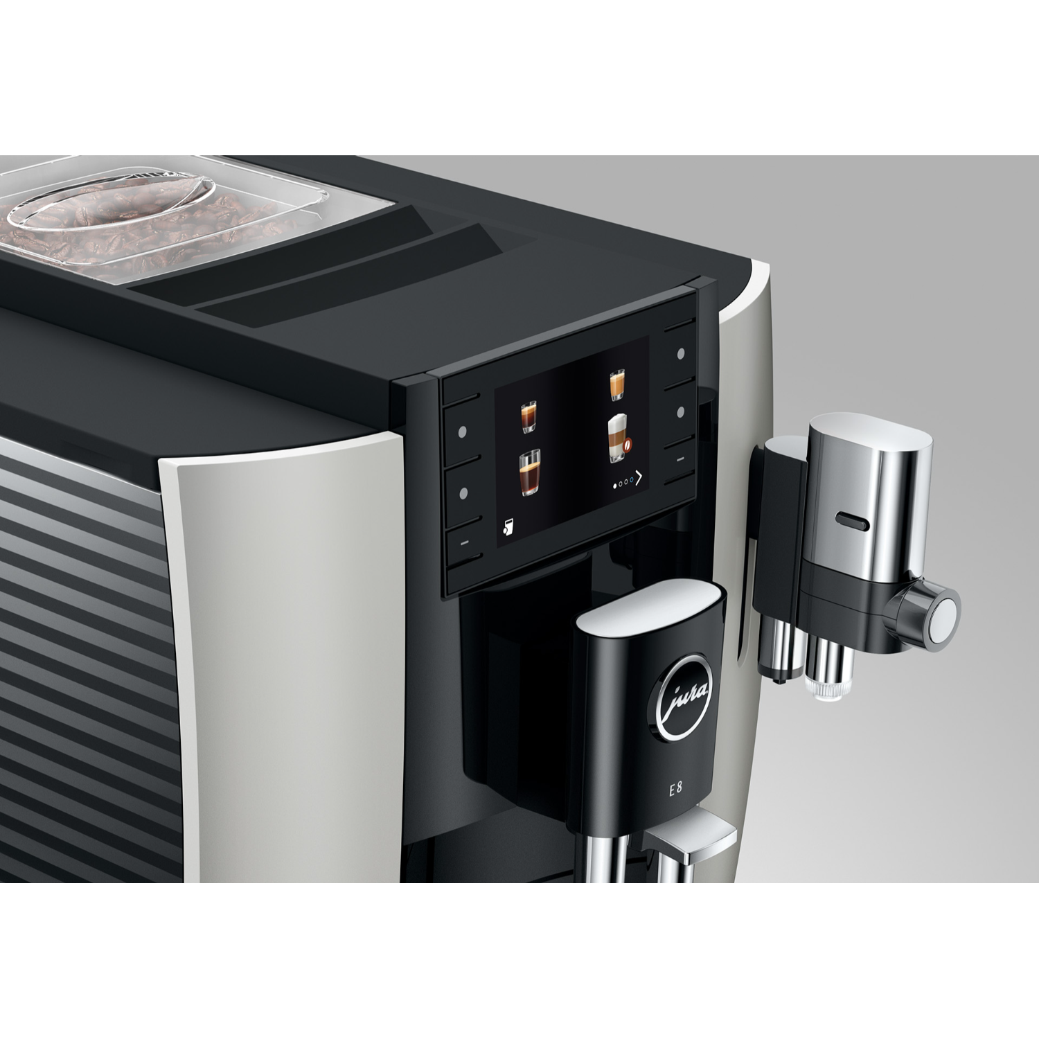 Nahaufnahme einer Jura Kaffeemaschine mit digitalem Bildschirm und Milchaufschäumer.