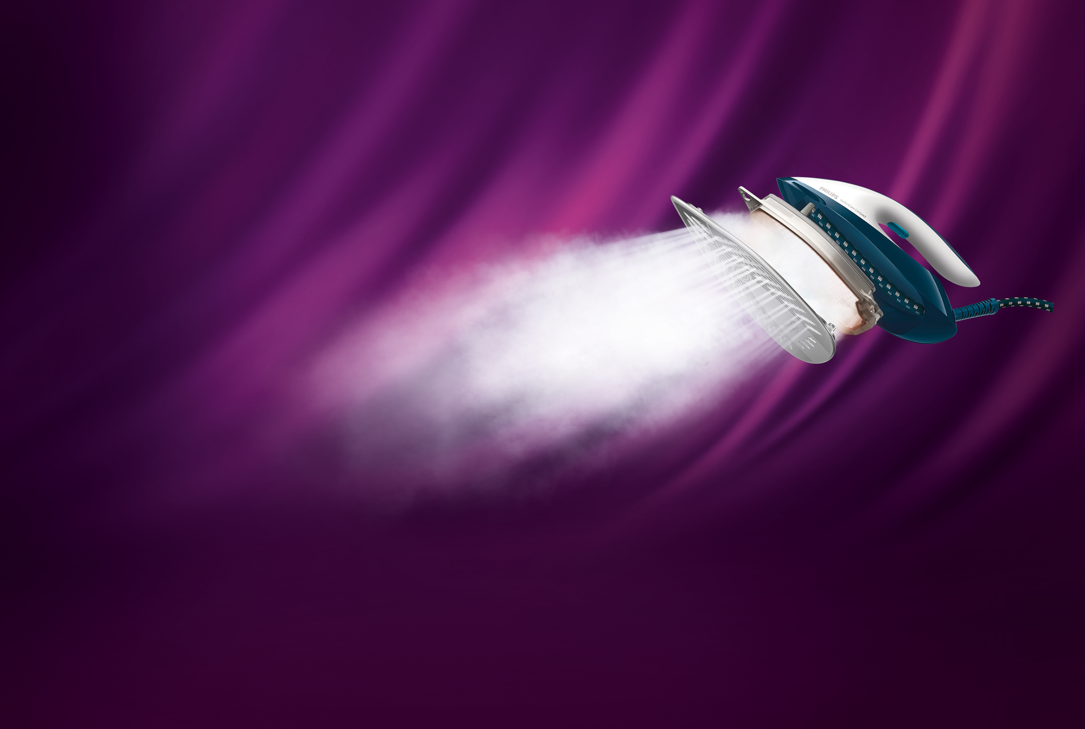A blue and white iron emits steam against a purple, blurred background.