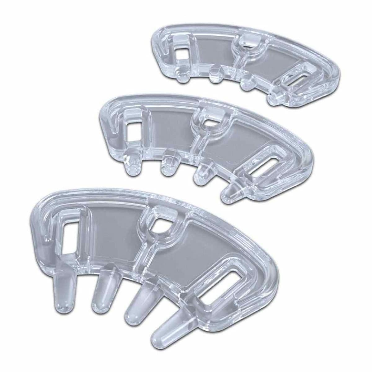 Trzy przezroczyste, plastikowe separatory palców u stóp ułożone pionowo. Każdy ma zakrzywiony kształt z wieloma zębami.