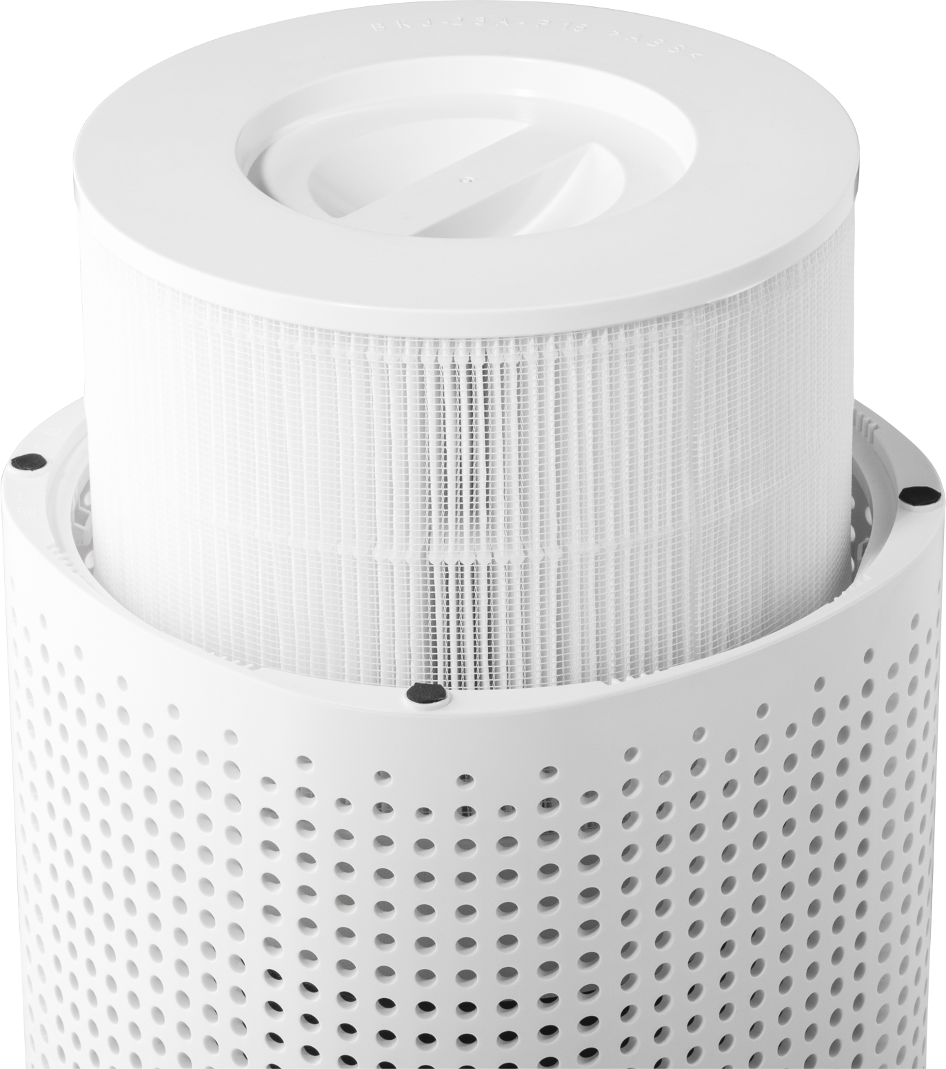 A white air purifier filter with a cylindrical shape, with a perforated bottom section.