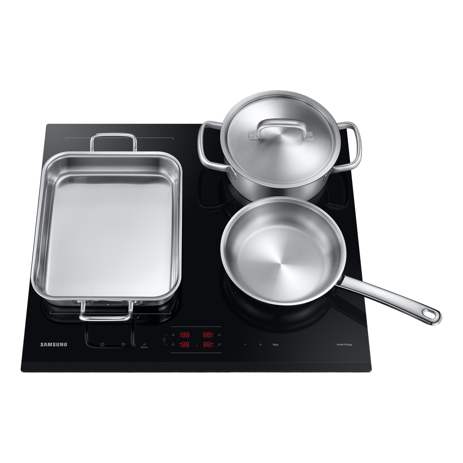 Czarna płyta indukcyjna z trzema patelniami ze stali nierdzewnej. Czarne tło.