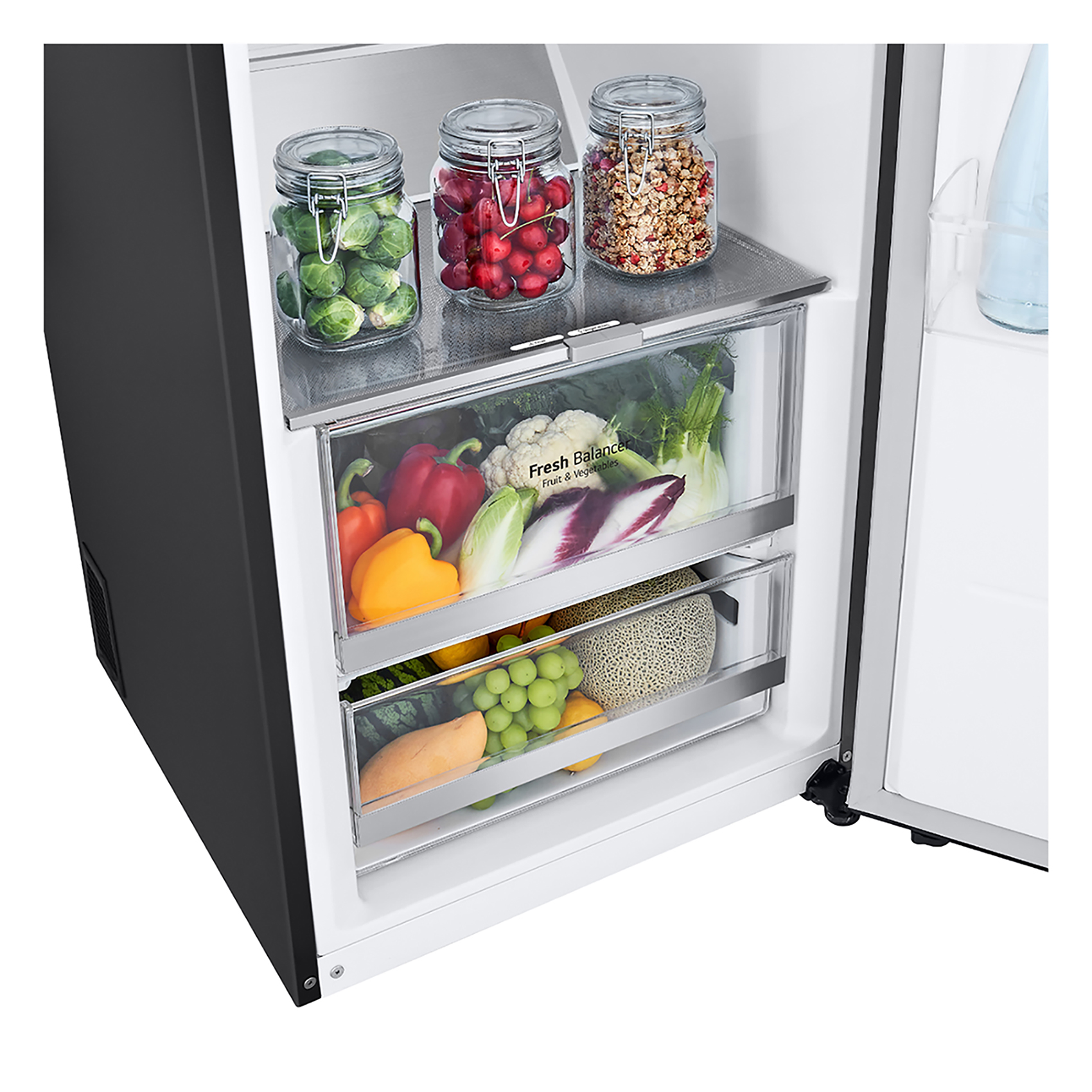 Interior de refrigerador con cajones con verduras y frutas.