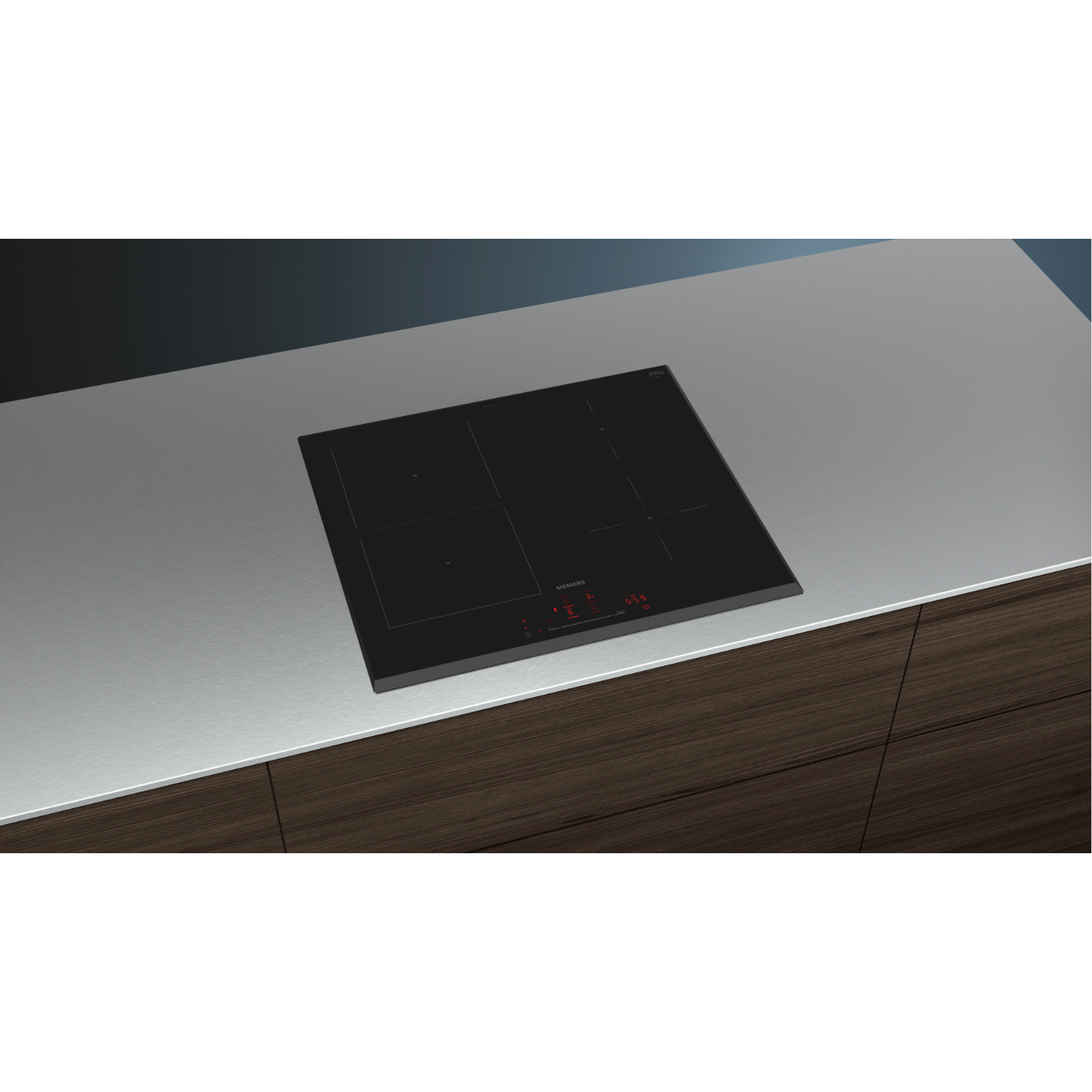 Piano cottura nero con display digitale rosso. È su un piano di lavoro metallico.