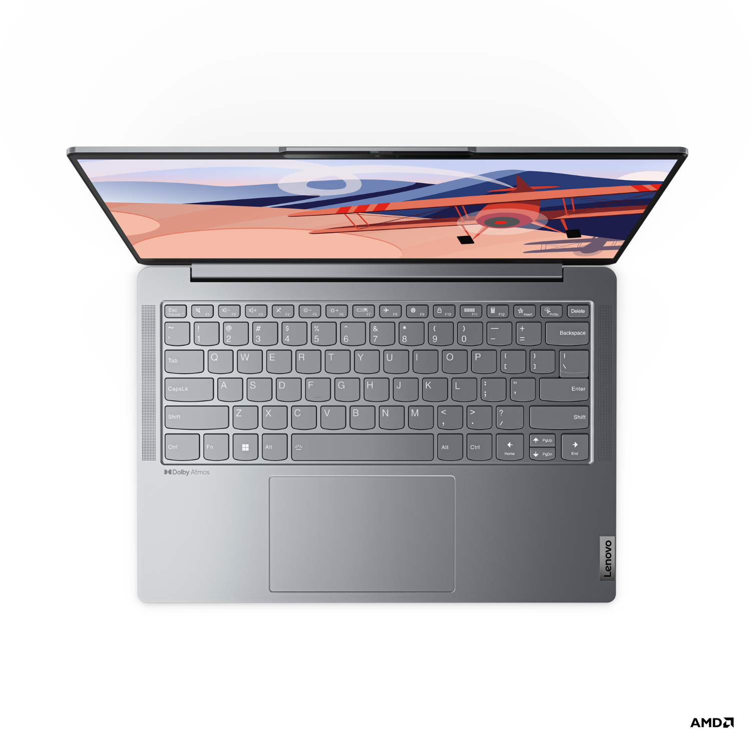 Ordinateur portable Lenovo gris ouvert, clavier visible, écran affichant une image colorée.