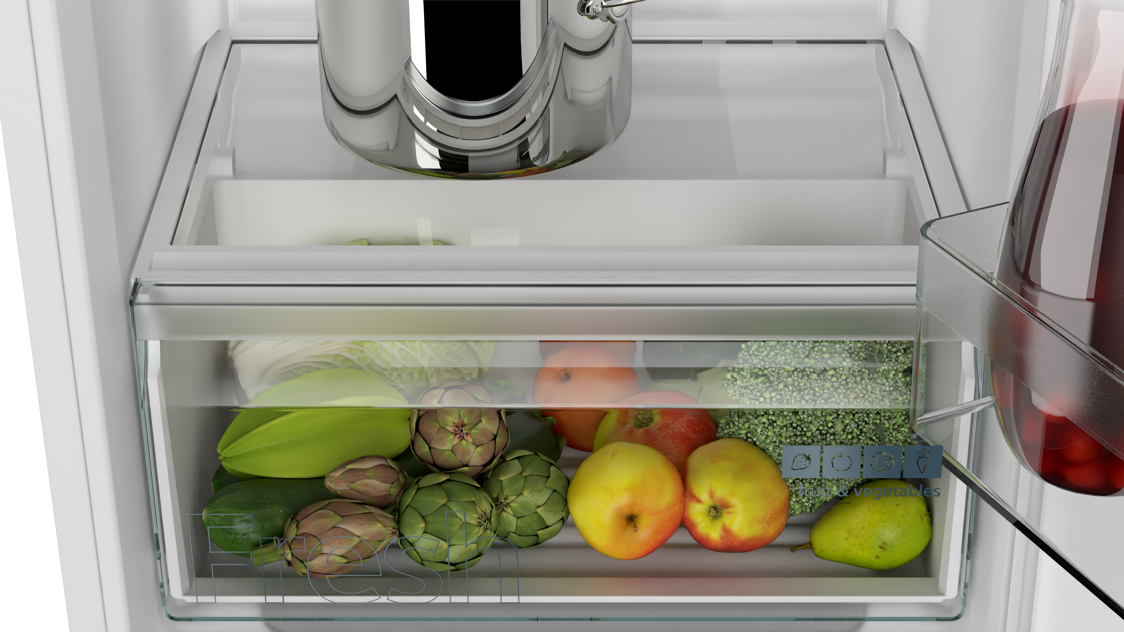 Refrigerator drawer with vegetables: artichokes, apples, and other fresh produce. Close-up view.