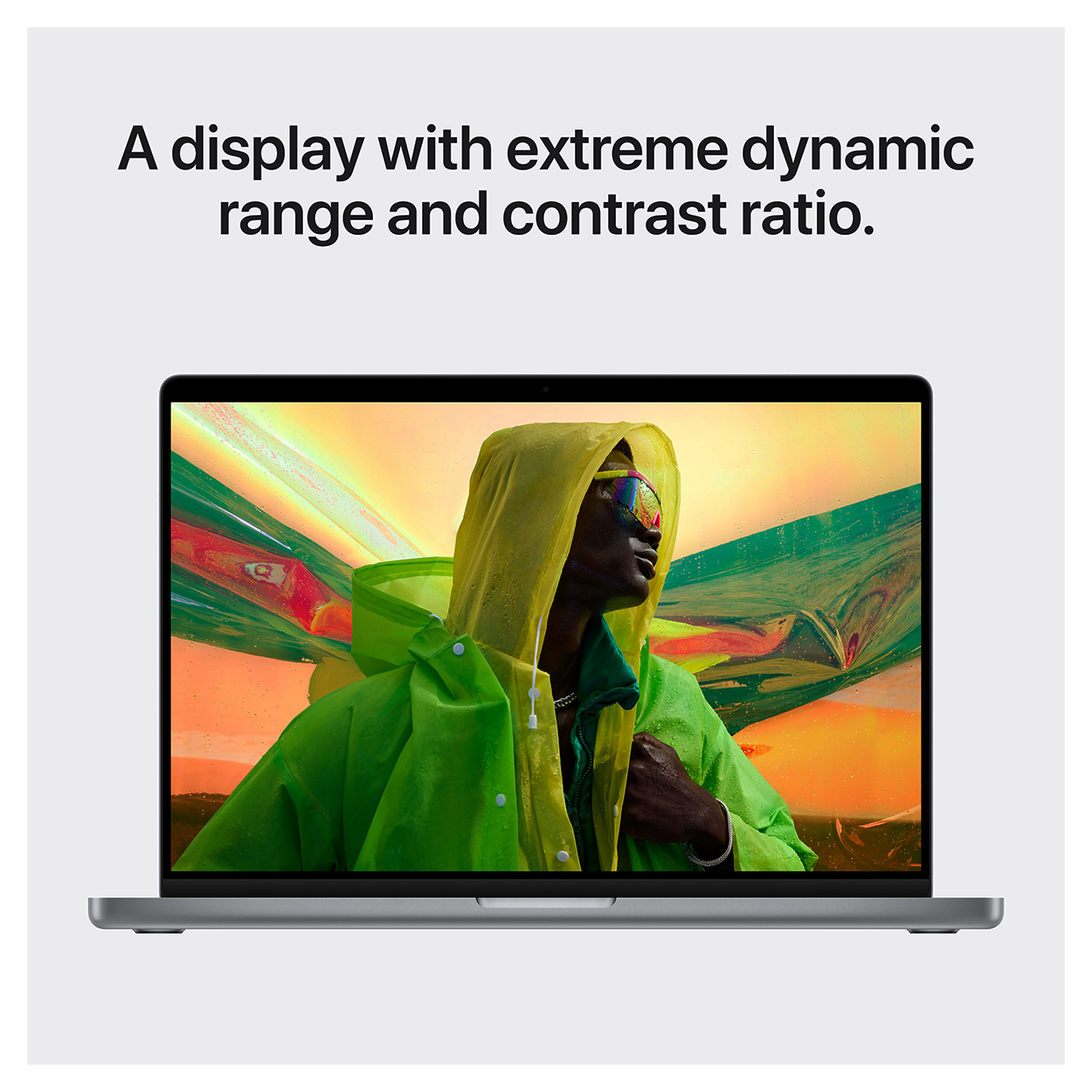 Ein Laptop zeigt eine farbenfrohe Szene. Der Text oben lautet: „Ein Display mit extremem Dynamikbereich…“