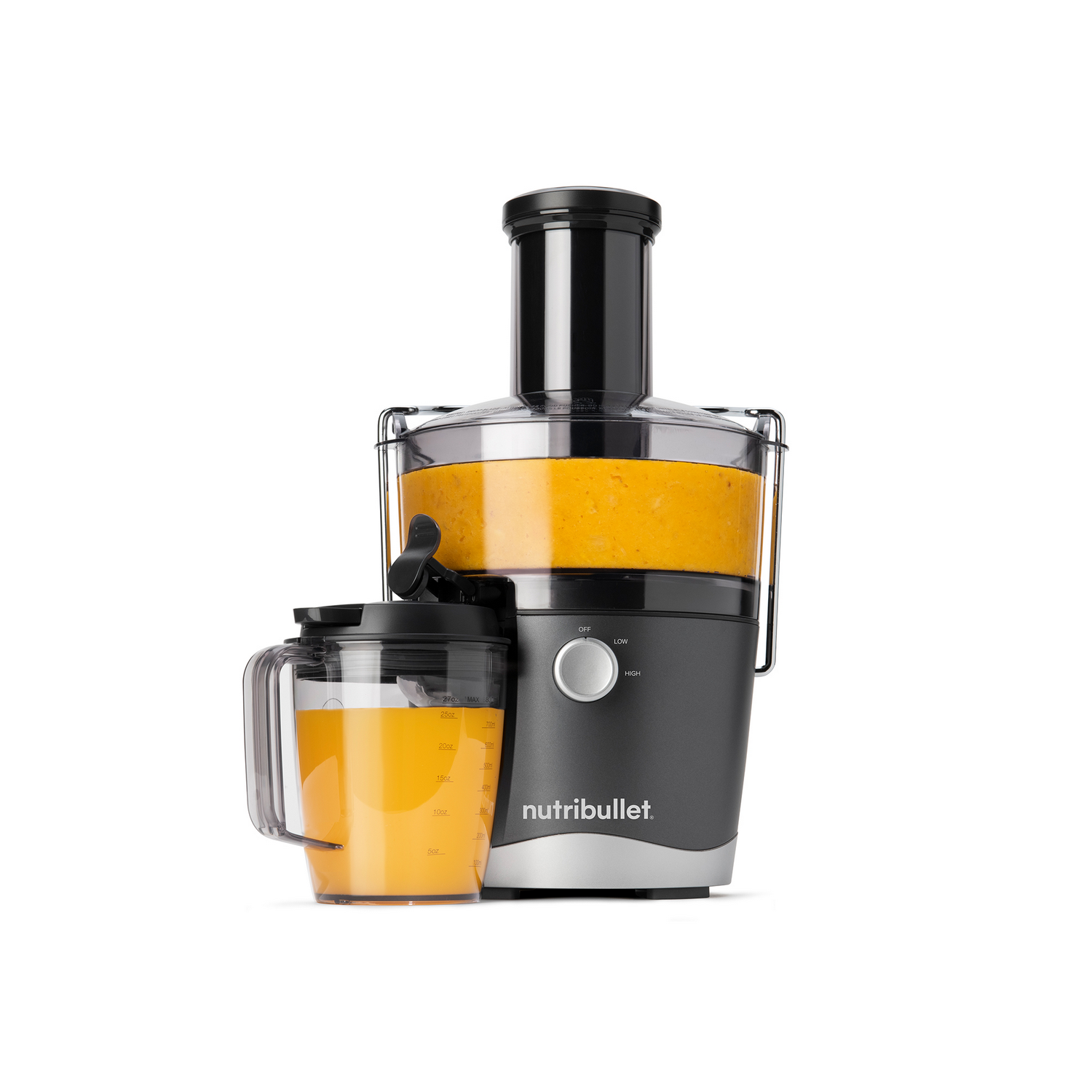 A Nutribullet juicer with orange juice in the container and a pitcher.