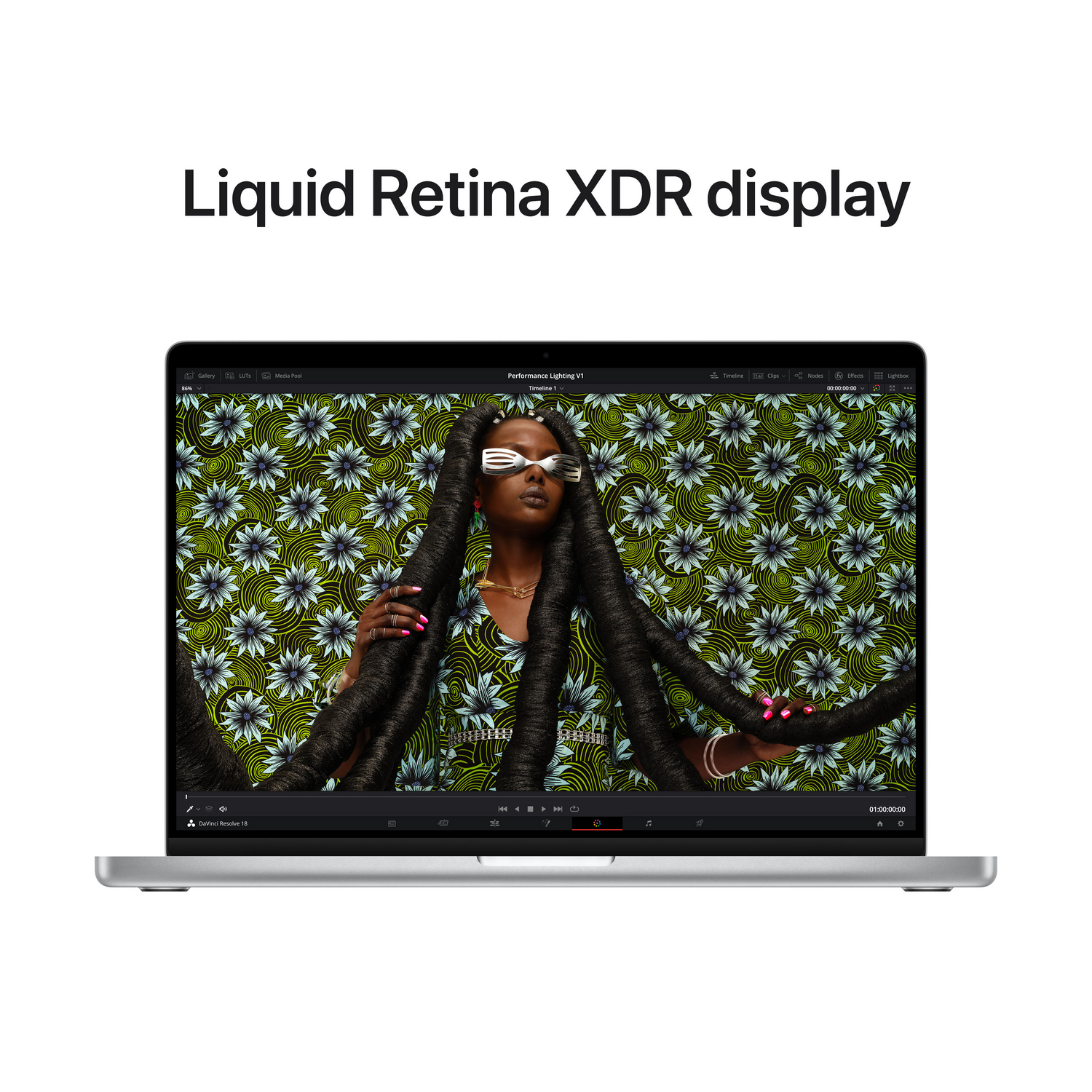Laptop wyświetlający kobietę na ekranie z kwiatowym tłem. Tekst 'Liquid Retina XDR display'.