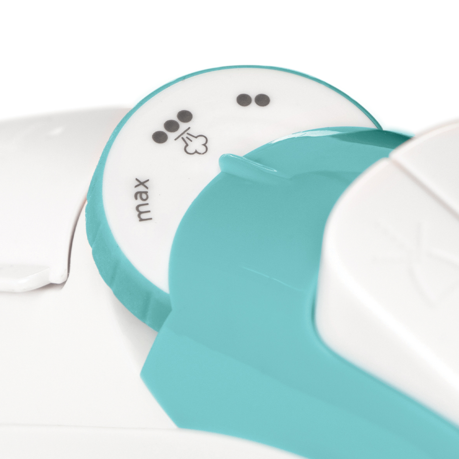 Zbliżenie pokrętła sterowania żelazkiem w kolorze turkusowo-białym, ze symbolami pary.