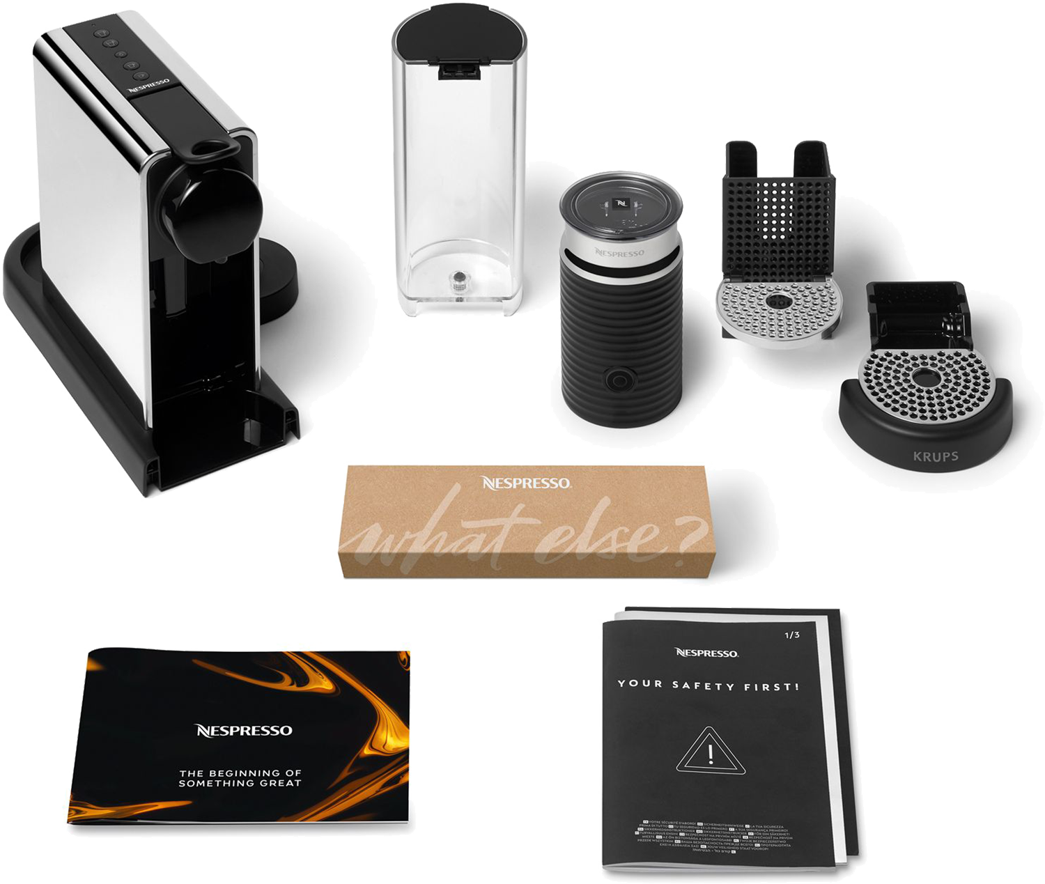 Ekspres do kawy z akcesoriami: spieniacz do mleka, kapsułki i instrukcje.