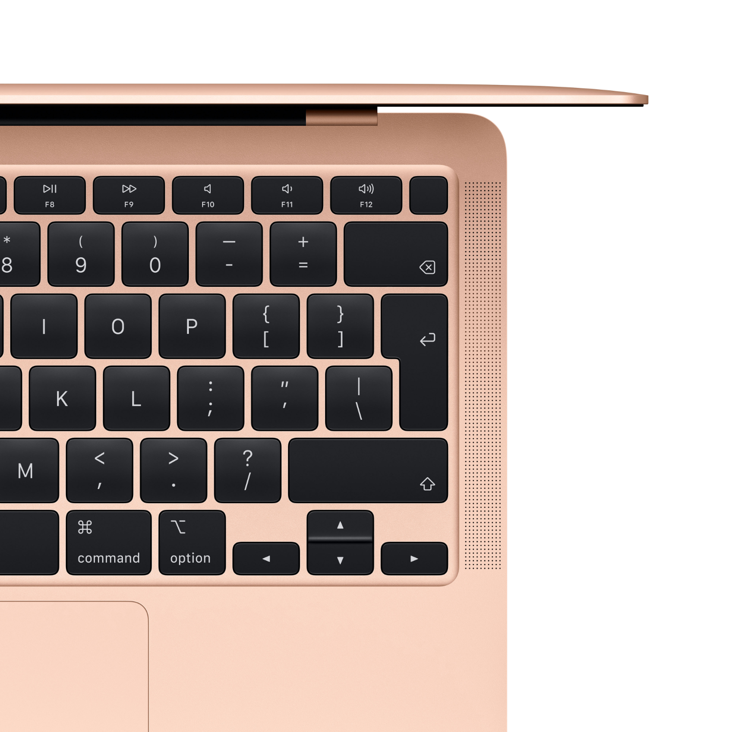 Detalle del teclado de un portátil rosa, mostrando teclas de comando y opción.