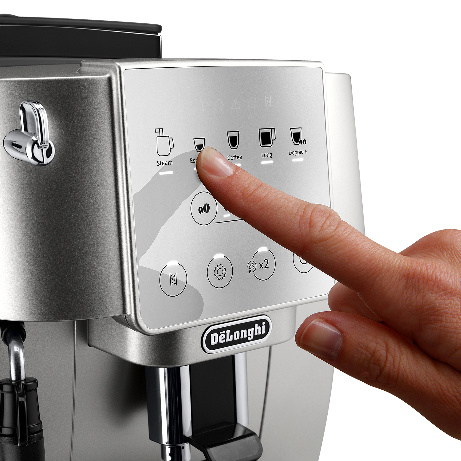 A hand pressing a button on a silver and white DeLonghi coffee machine.