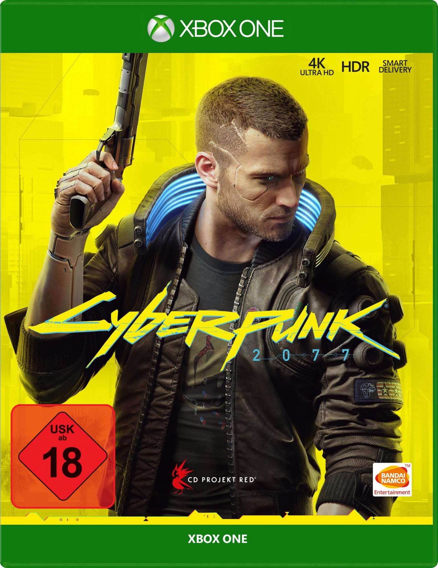 Okładka gry Cyberpunk 2077. Mężczyzna trzymający broń, żółty i czarny tekst na żółtym tle.