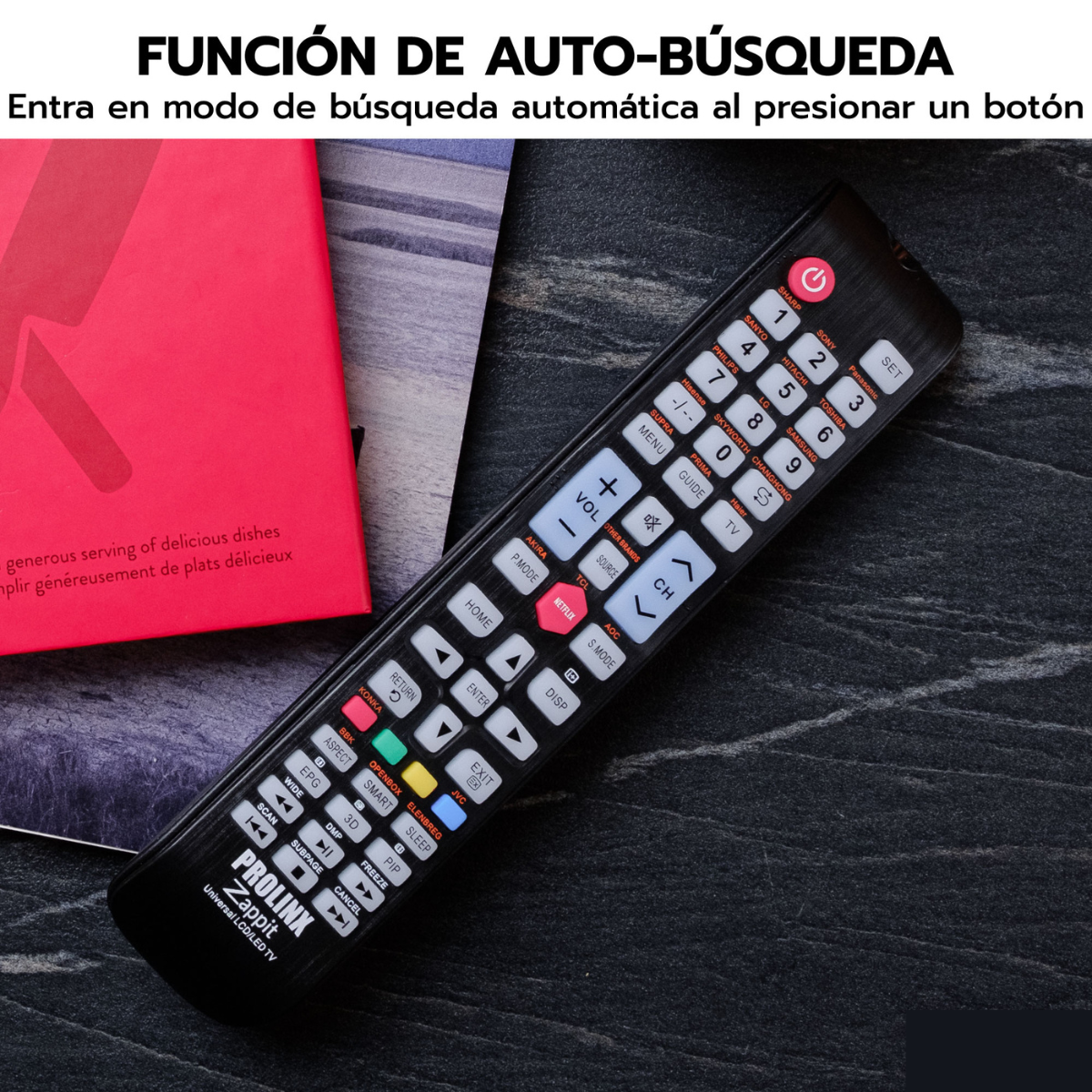 Mando a distancia en superficie oscura, libro rojo a la izquierda, texto arriba.