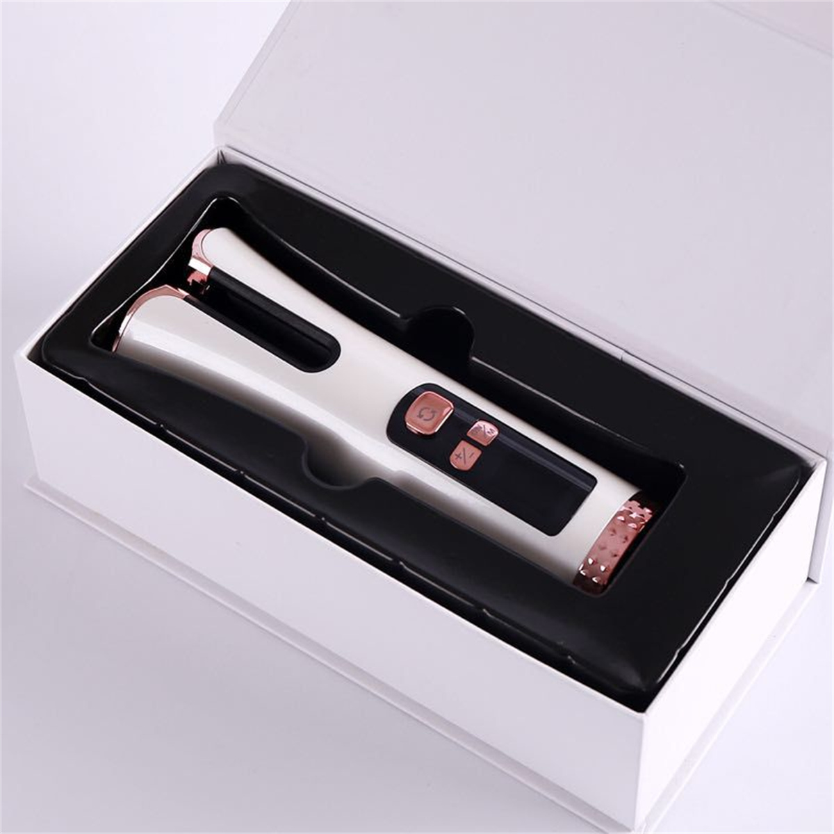 Weißer und roségoldener Haarlockenwickler in einer weißen Box.