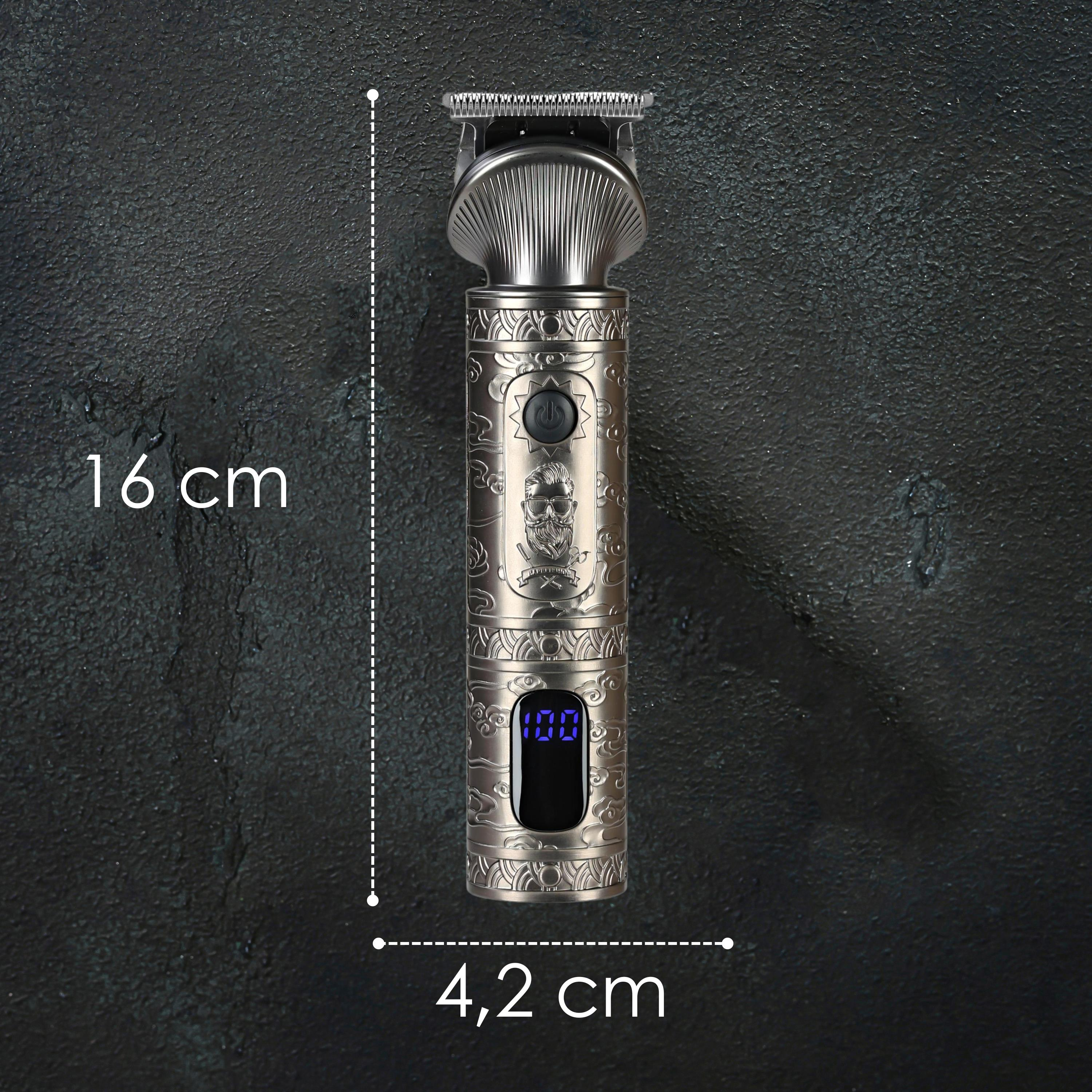 Srebrna maszynka do włosów z grawerowanym wzorem, wymiary 16 cm i 4,2 cm.