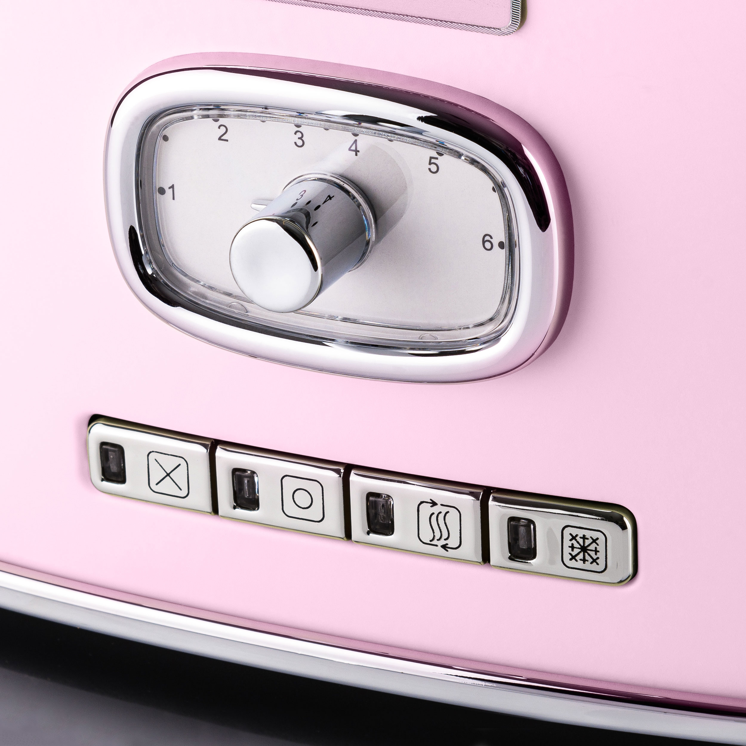 Nahaufnahme eines rosa Toasters mit Timer-Knopf und Knöpfen.