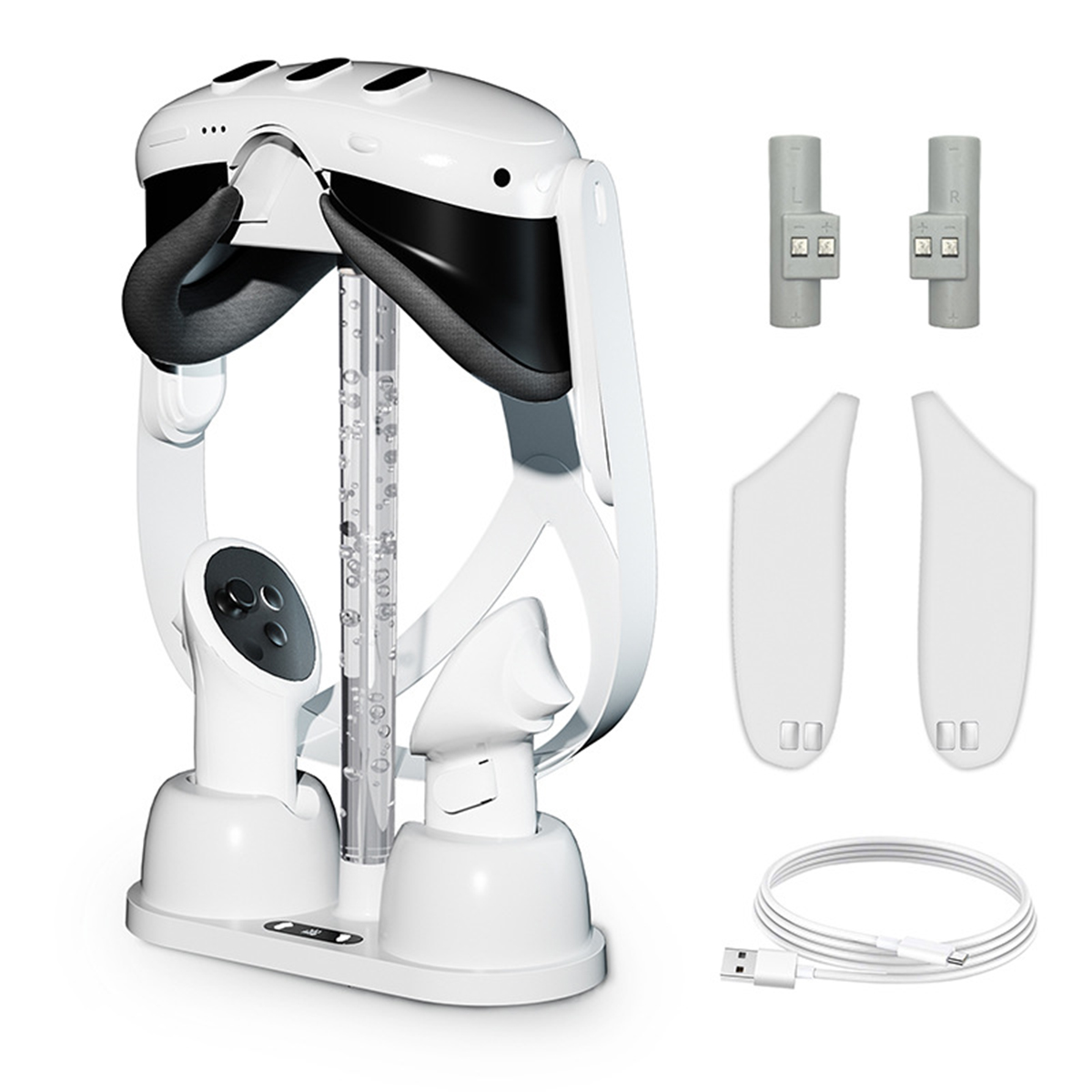 Ein VR-Headset, eine Basis und Zubehör auf weißem Hintergrund. Es ist weiß und schwarz.