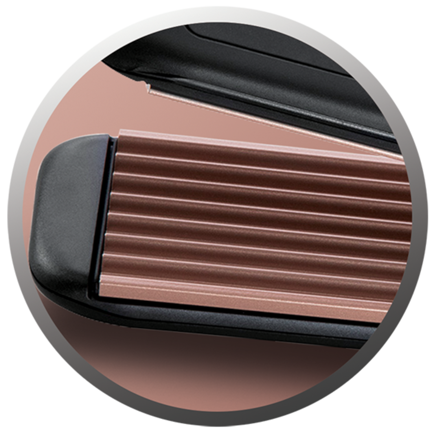 Close-up of a hair crimper. The plates have a wavy, textured design.