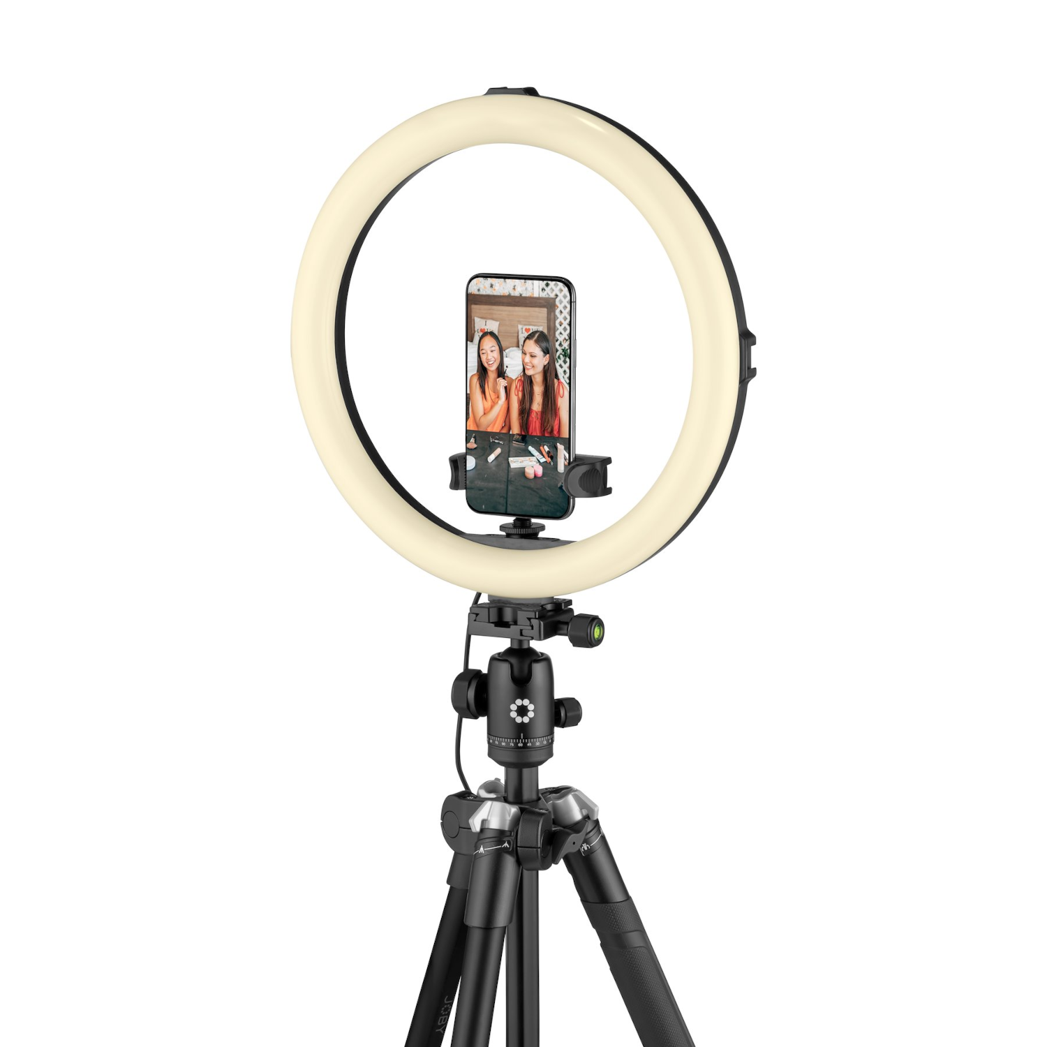 Une lampe annulaire avec un smartphone au centre, soutenue par un trépied, sur fond blanc.