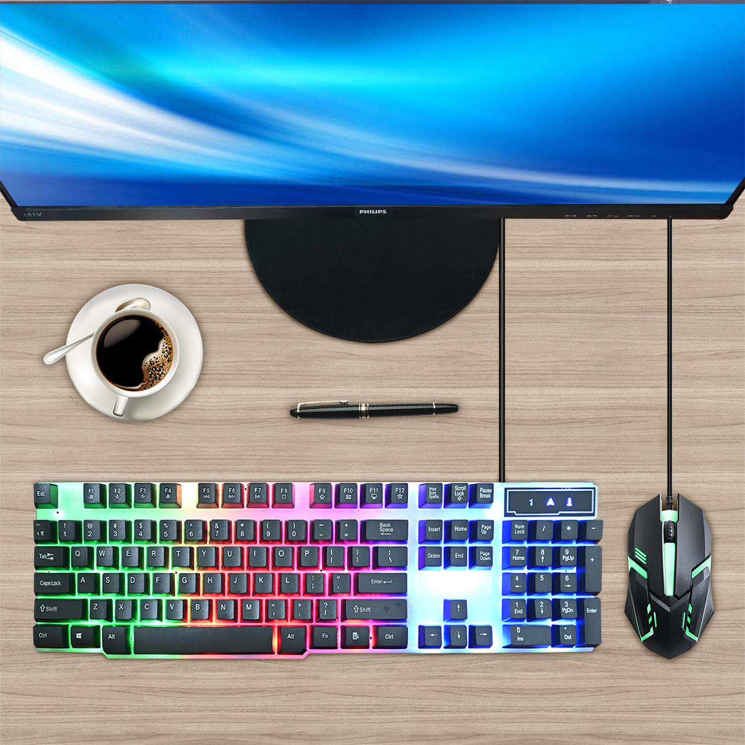 Escritorio con un monitor, teclado, ratón, café y un bolígrafo.