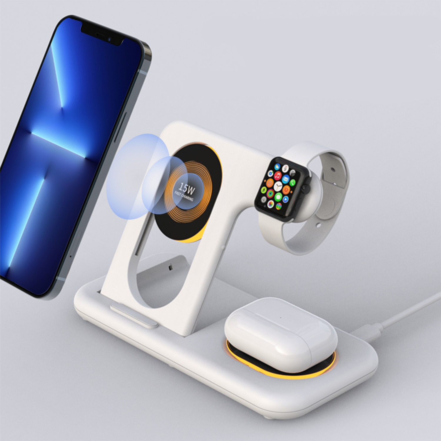 Una stazione di ricarica wireless con telefono, orologio e auricolari. Il telefono è blu.