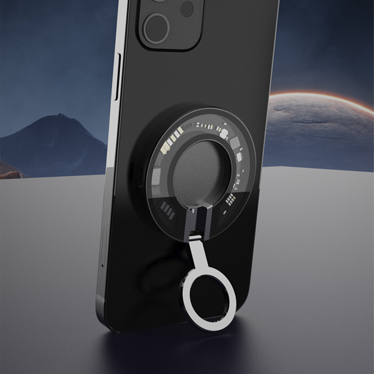 Un telefono nero con un supporto ad anello attaccato. Un pianeta è sullo sfondo.