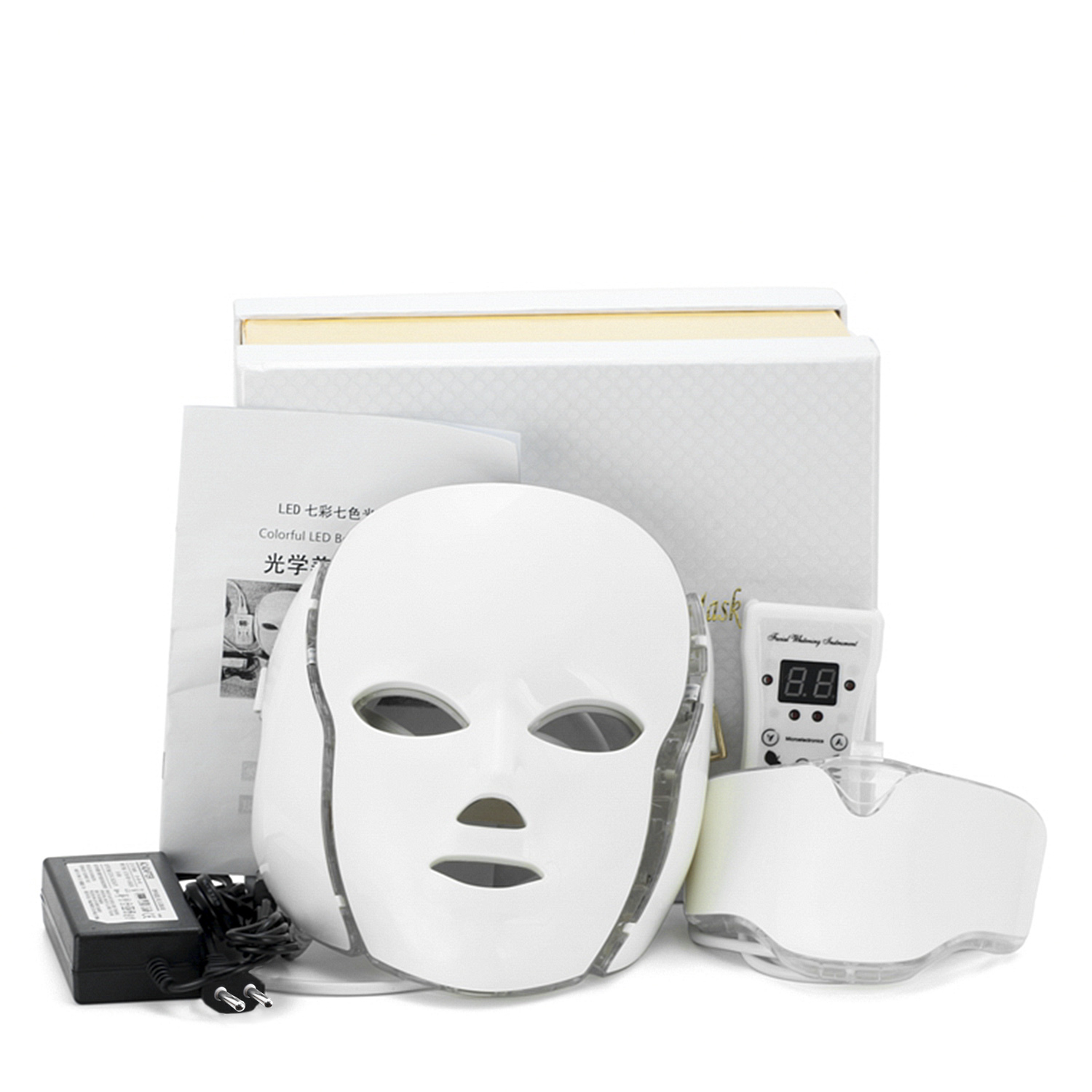 Mascarilla LED blanca con accesorios: controlador, protector ocular y adaptador de corriente, todo en una superficie blanca.