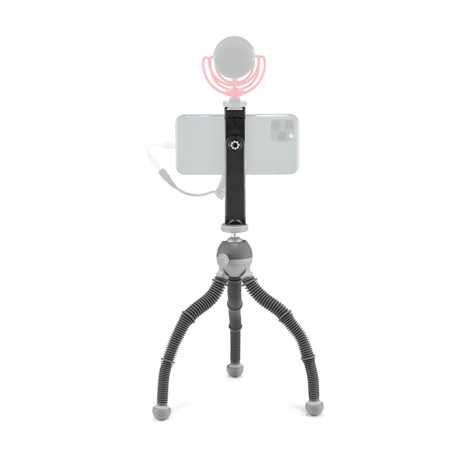 Un smartphone monté sur un mini trépied. Un microphone est fixé au téléphone.