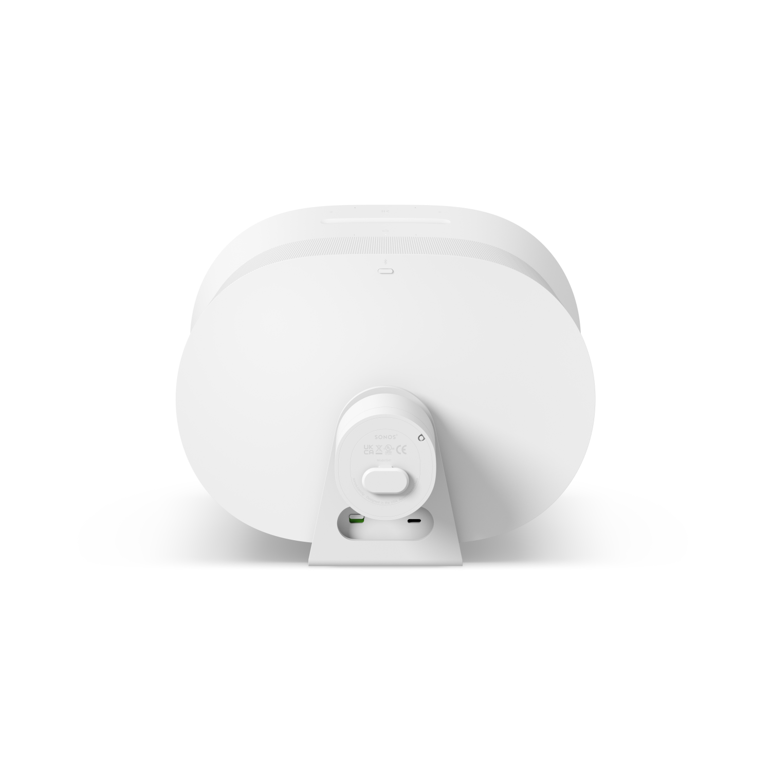 Altavoz blanco en un soporte. El soporte es blanco. Es desde la parte trasera.