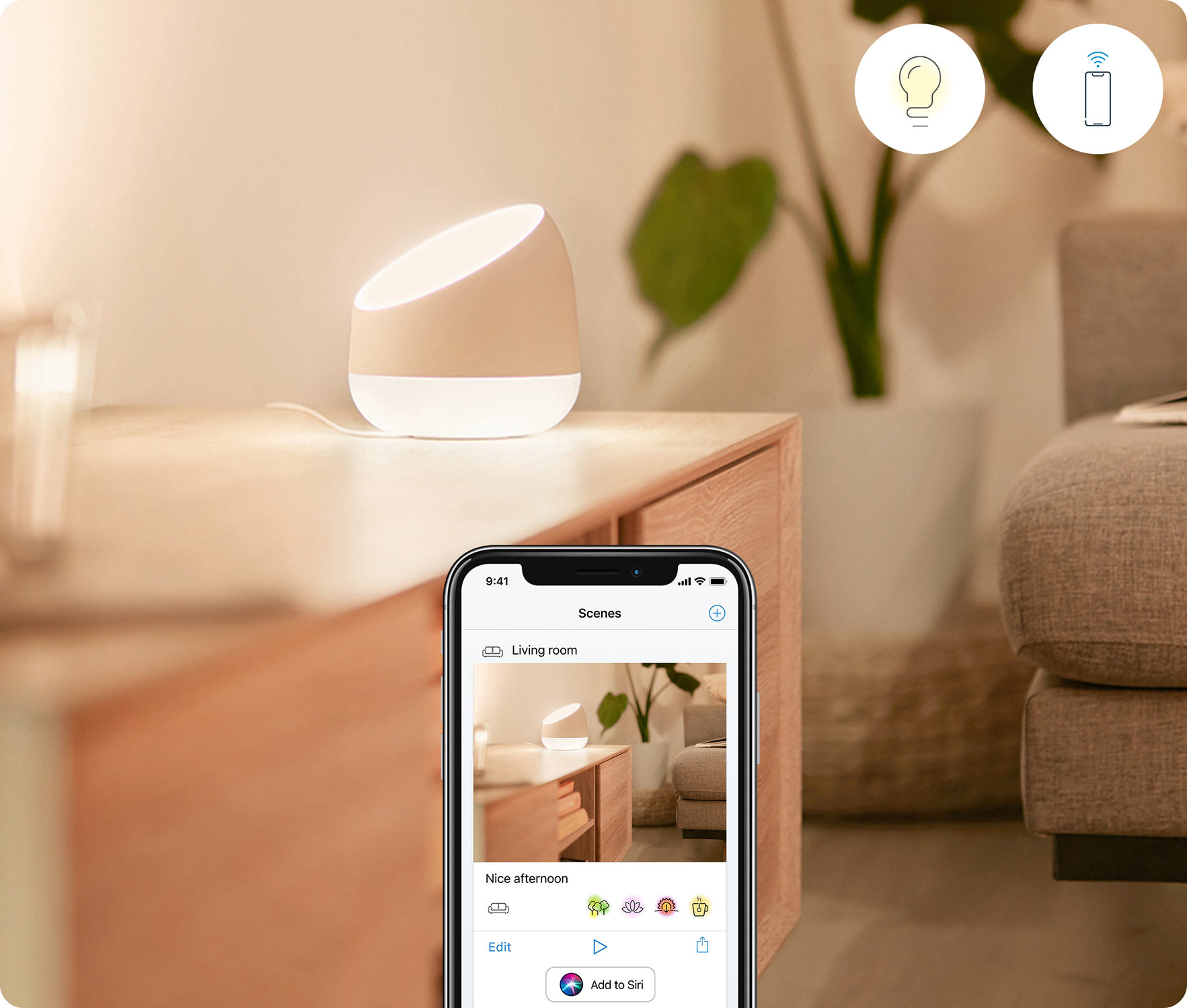 A smart lamp on a table with a phone displaying a smart home app.
