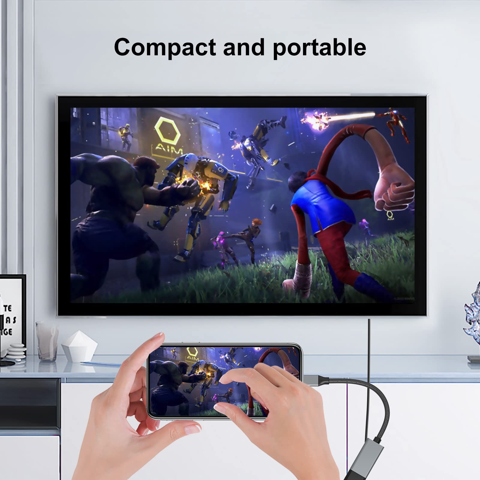 Person hält Telefon, verbunden mit Fernseher, der ein Videospiel zeigt. Text: 'Compact and portable'.