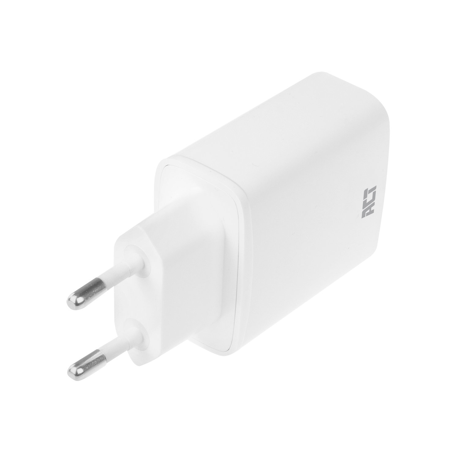 A white plug-in adapter with two silver prongs, viewed from an angle against a white background.