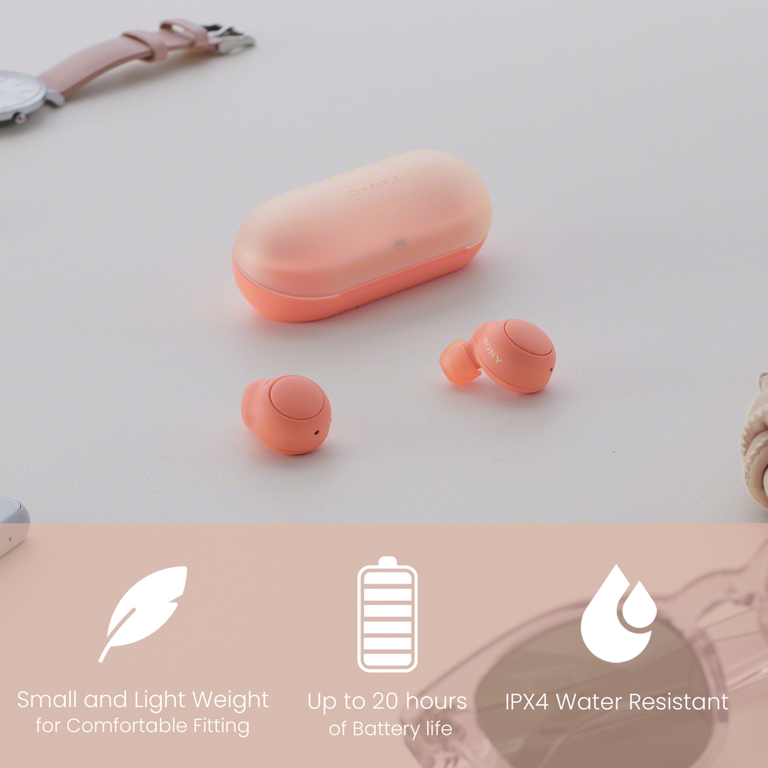 Auriculares rosas con estuche de carga y fondo blanco. Diseño pequeño y ligero.