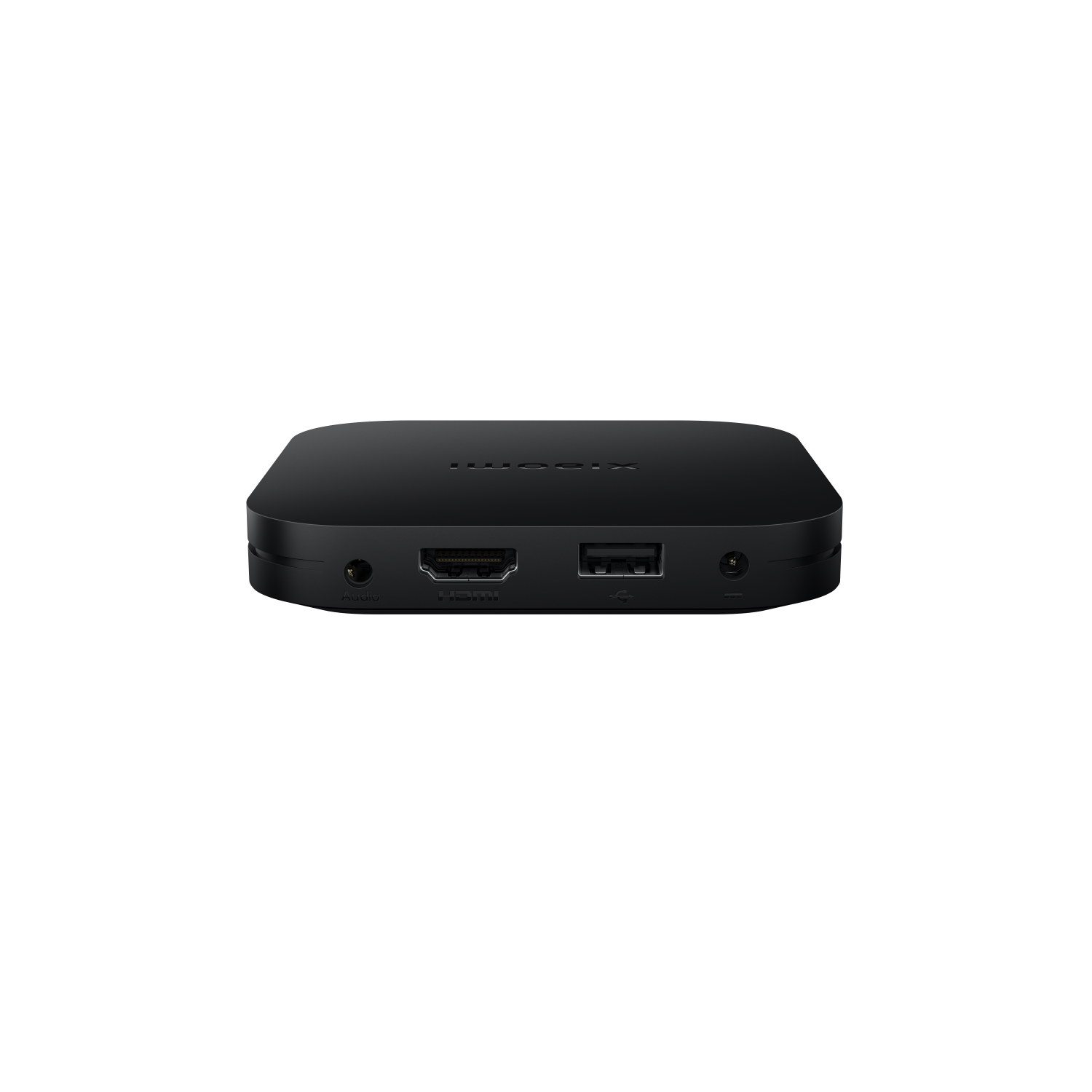 Caja de TV negra con puertos frontales. Fondo negro.