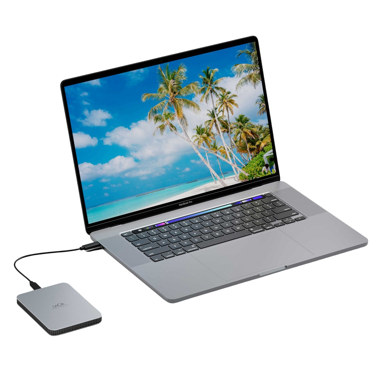 Laptop z obrazem plaży na ekranie. Podłączony dysk zewnętrzny, na czarnym tle.