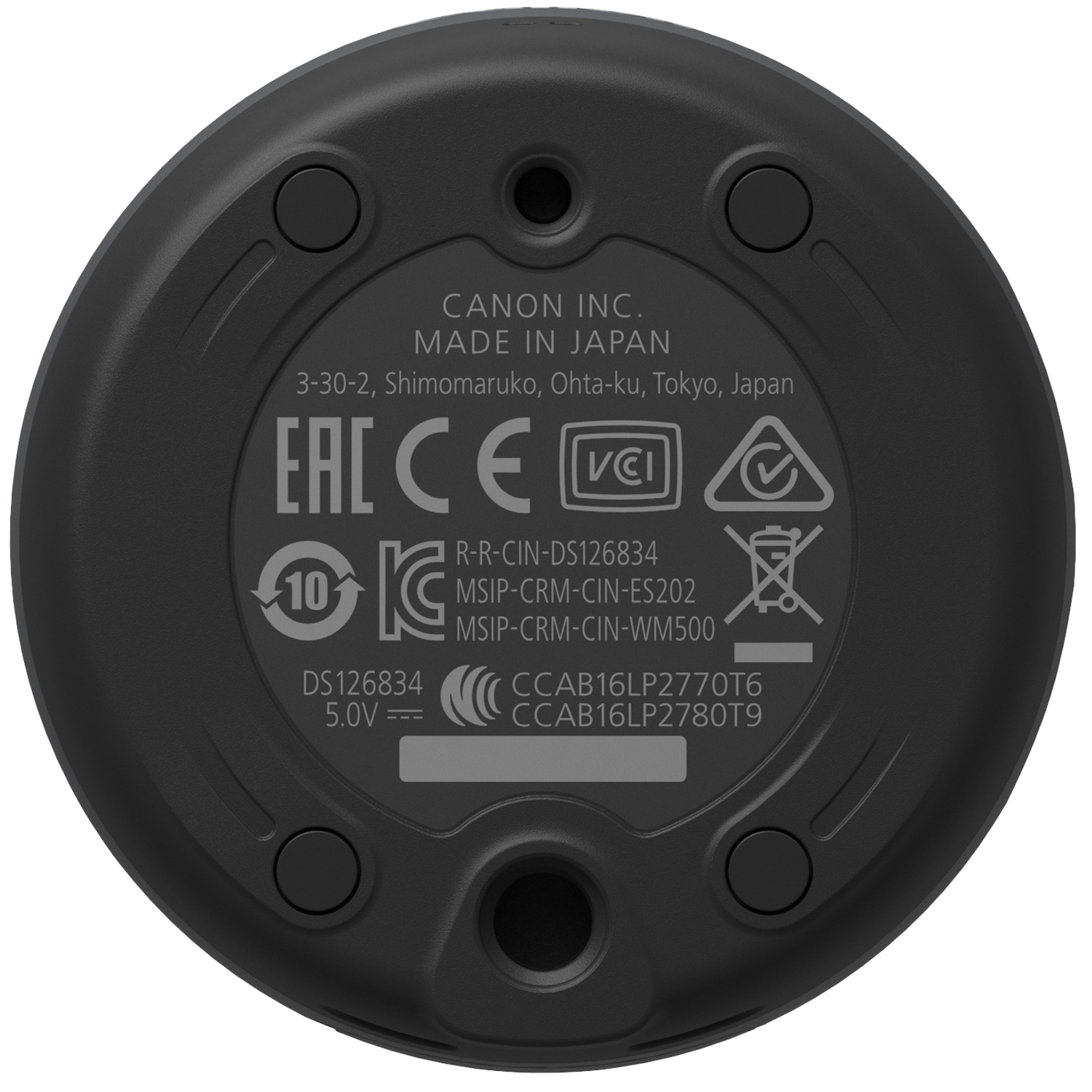 Schwarze Unterseite eines kreisförmigen Geräts mit verschiedenen Markierungen, einschließlich Markenname, Spezifikationen und Logos.