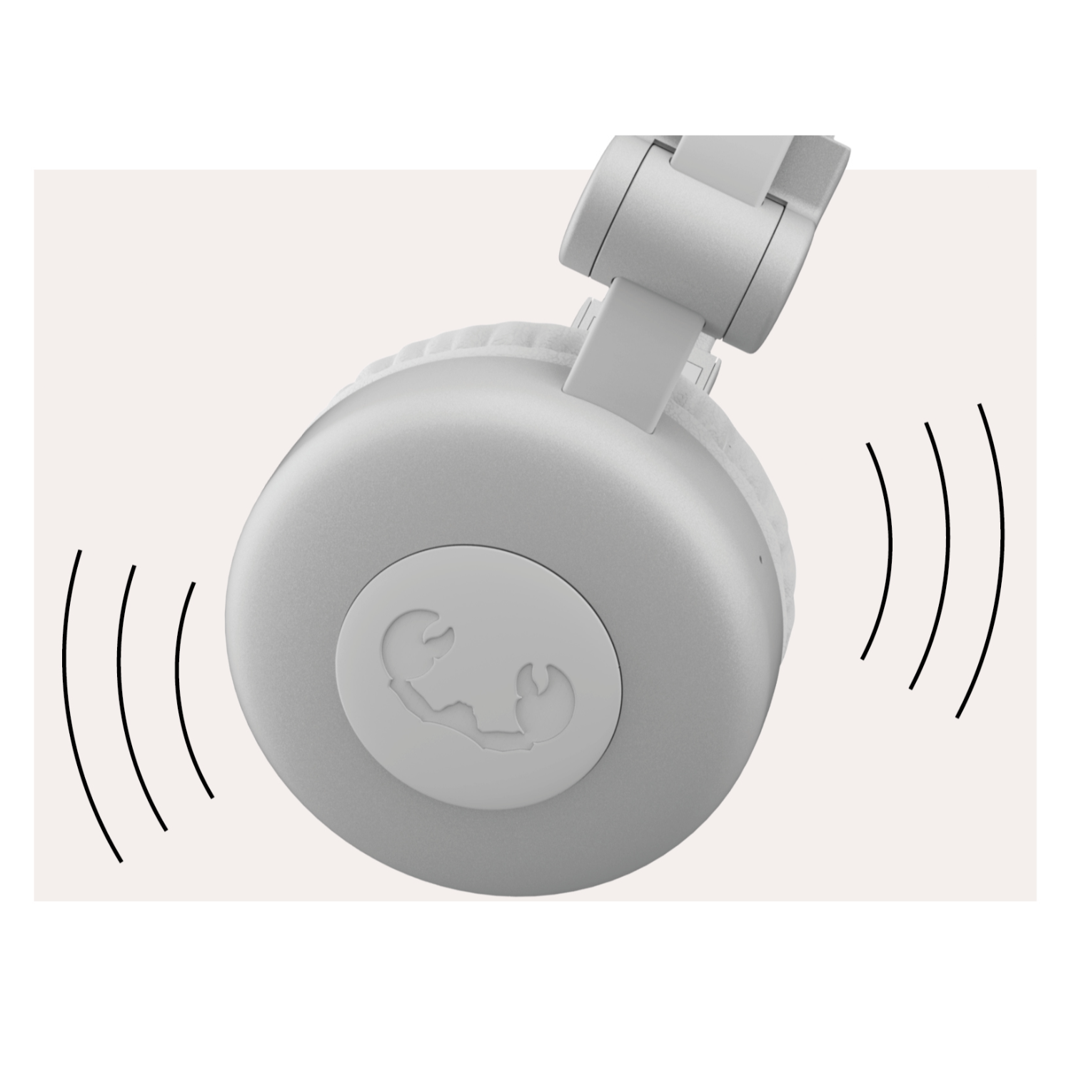 Primo piano di cuffie grigie con onde sonore che emanano dal padiglione.