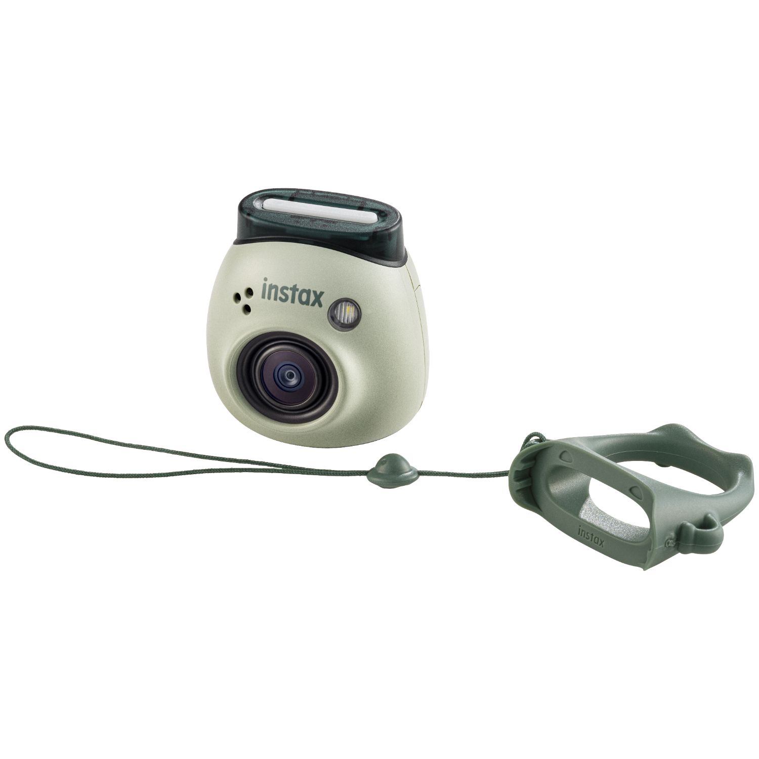 Mały, jasnozielony aparat Instax z paskiem na rękę. Aparat ma obiektyw i przycisk.